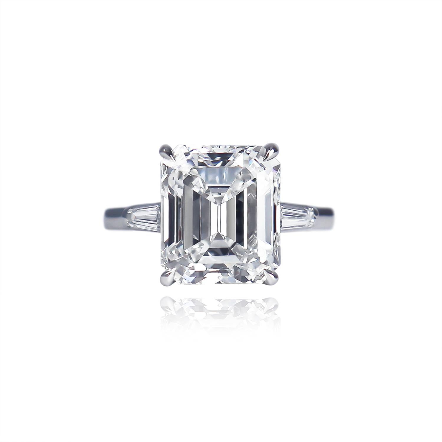 This breathtaking, platinum, Tiffany & Co. ring features a GIA certified 5.25 carat emerald cut diamond of E color and VS2 clarity. Set in a signed ring with tapered baguettes = approximately 0.40 carat total weight, this piece is a contemporary