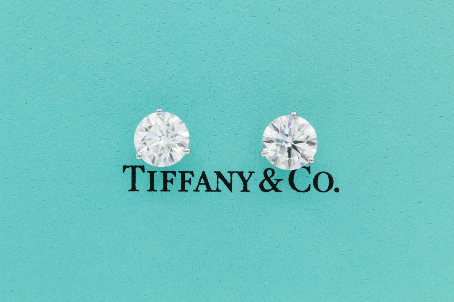 We are pleased to present these Tiffany & Co. GIA Certified and Crown Inscribed Platinum & Round Brilliant Cut Diamond Stud Earrings. These beautiful earrings feature two Tiffany & Co. GIA certified and crown inscribed Diamonds. One 2.25ct G/VVS2