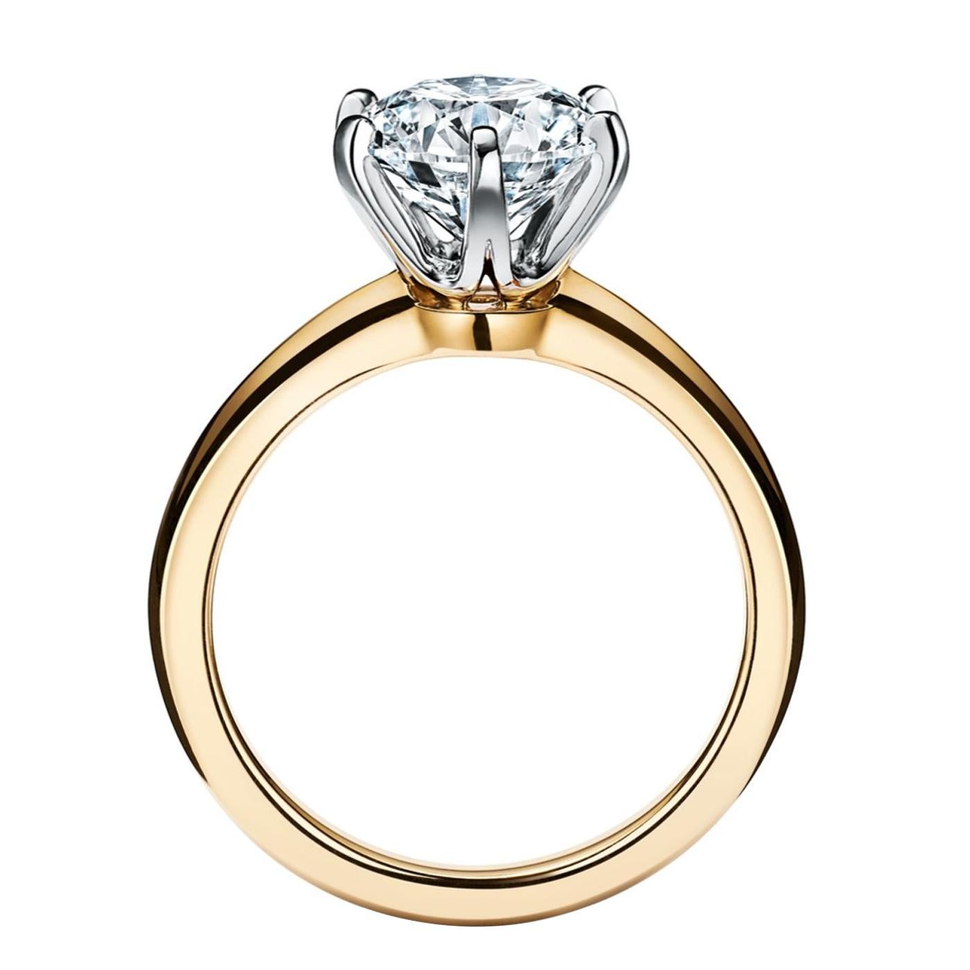 A true design masterpiece, the Tiffany Setting is the world’s most iconic engagement ring. Flawlessly engineered, the six-prong setting virtually disappears and allows the brilliant diamond to float above the warm 18k yellow gold band and into the