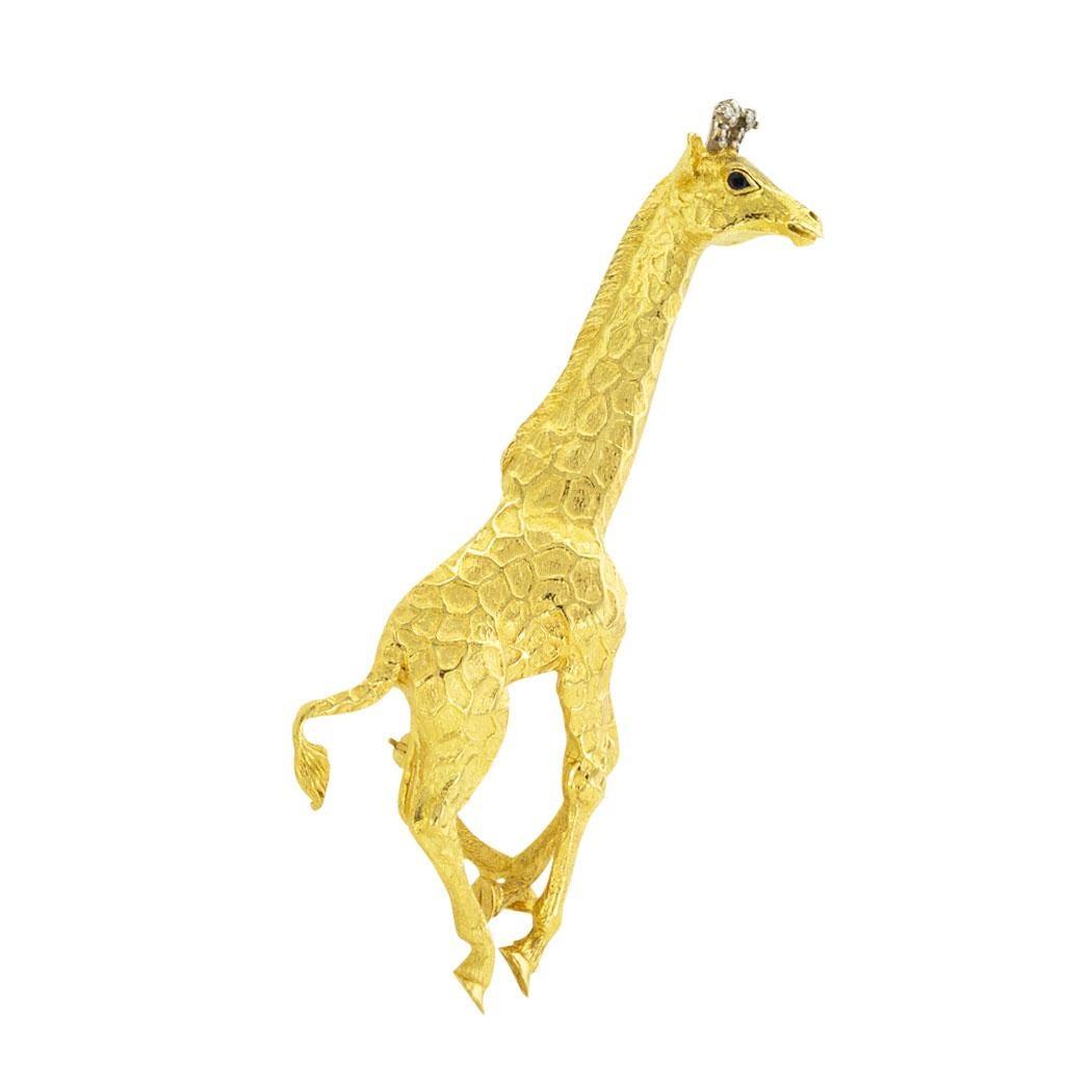 
Tiffany & Co diamond and sapphire giraffe yellow gold brooch circa 1990. *

ABOUT THIS ITEM:  #P-DJ131D. Scroll down for detailed specifications.  Tiffany & Co uses a large-scale design to encapsulate in exquisite detail the look of this trotting