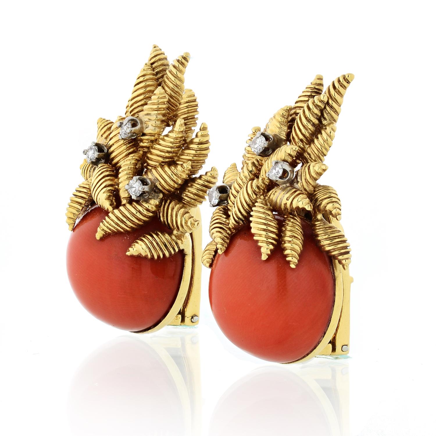 18K Yellow Gold Coral And Diamonds Earrings.
Beautiful clip on gold earrings in 18K solid gold with a bold round coral and textured yellow gold leaves coming up the ear.

These earrings are from the 1960's so expect some wear in the back but we will