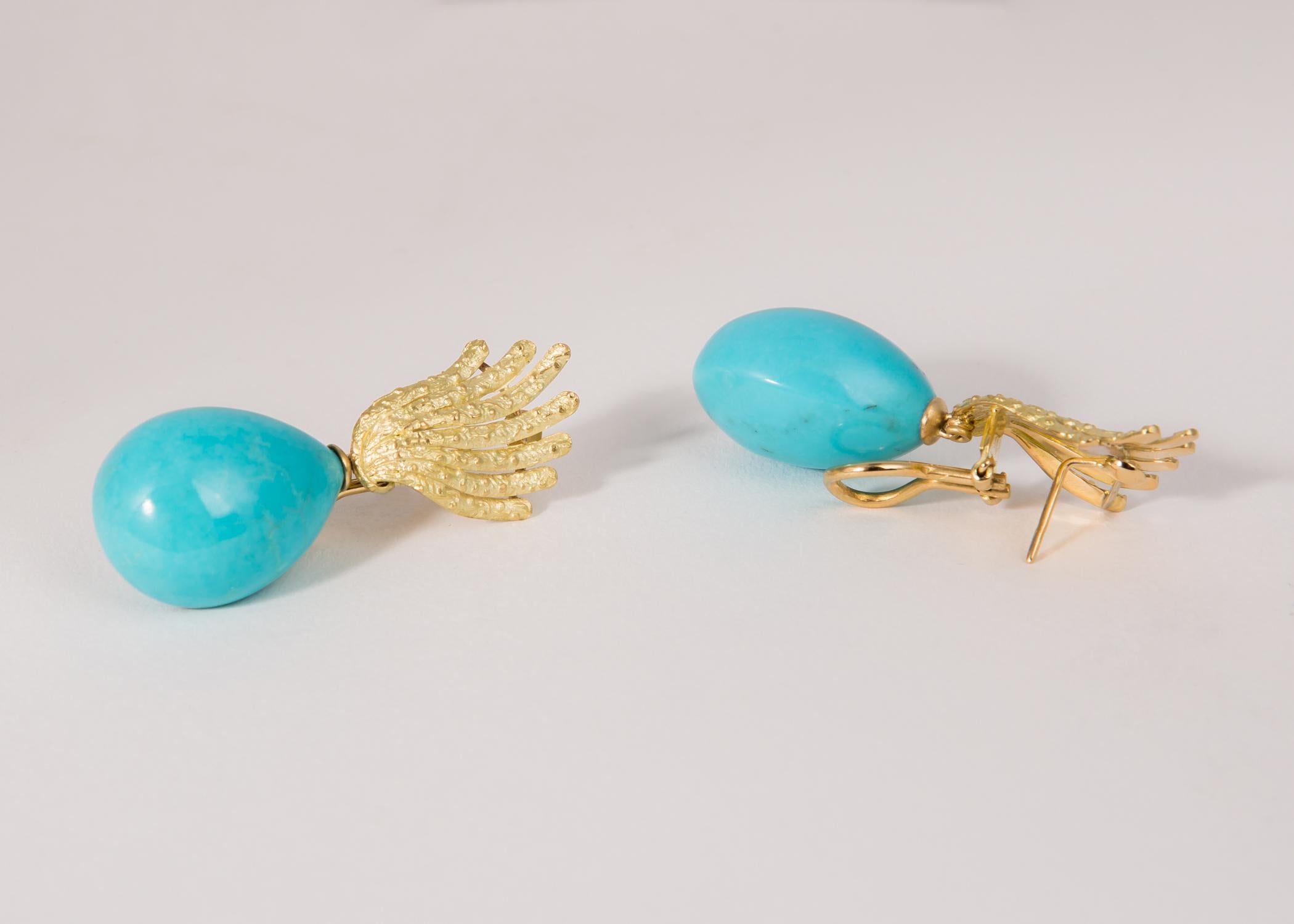 Tiffany & Co. Americas Jeweler. Their classic style and quality shine through in this gorgeous turquoise and gold earring. 1 7/8's inches long.