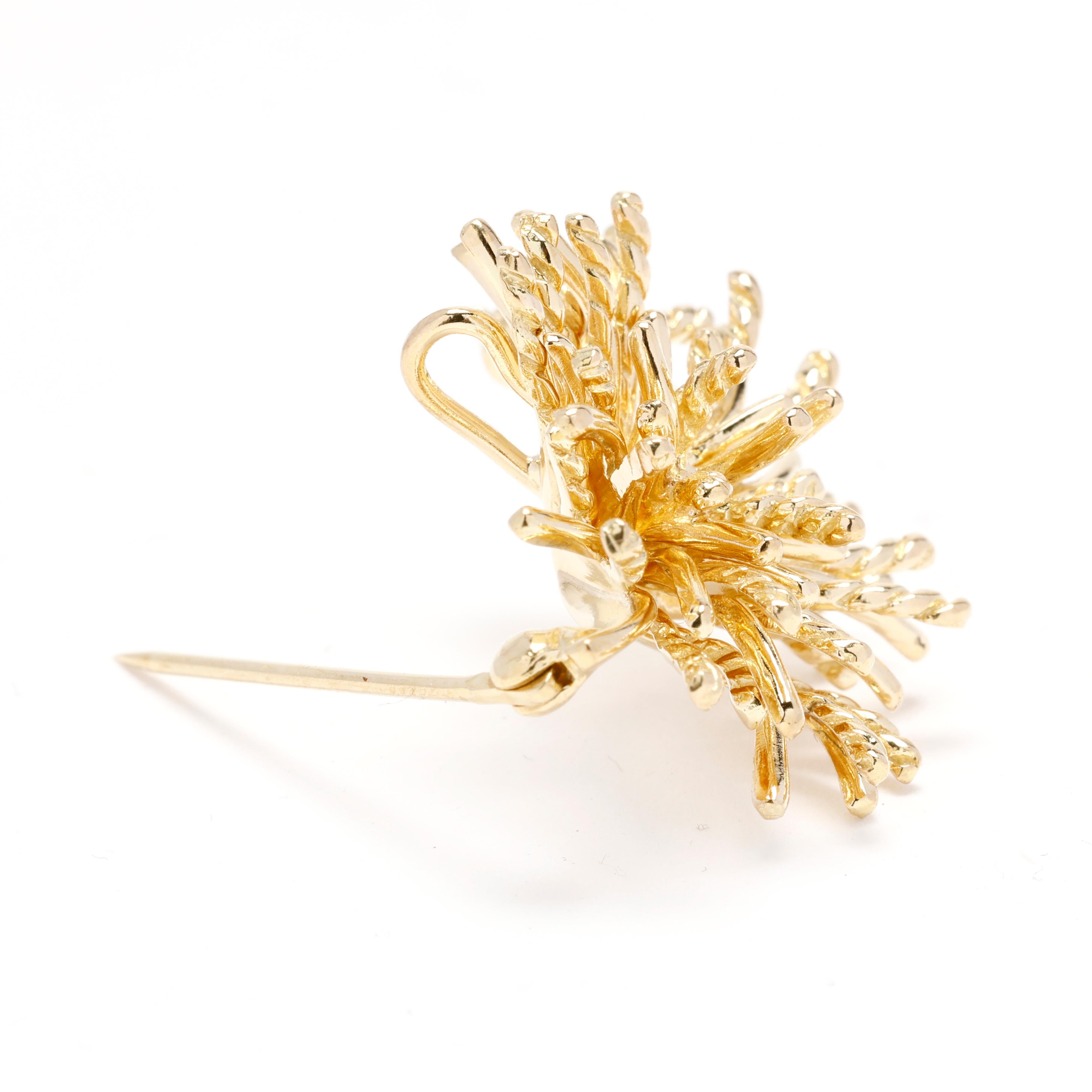 Experience the epitome of luxury with this exquisite Tiffany & Co. Gold Anemone Brooch. Crafted in lustrous 18k yellow gold, this stunning designer piece showcases the intricate beauty of anemone flowers, making it a standout statement accessory