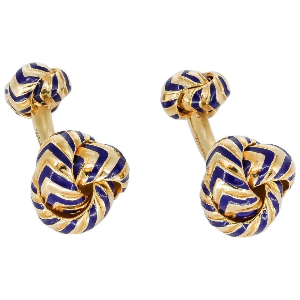 Stylish 18K yellow gold and chevron pattern blue enamel knot cufflinks by Tiffany & Co. Beautifully made and easy to wear. 1.25 in. (31.75 mm)

