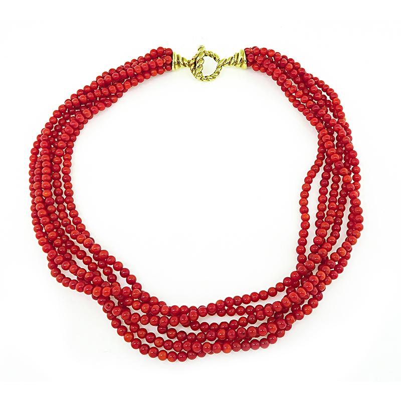 This is a fabulous 18k yellow gold coral necklace by Tiffany & Co. The necklace features 6 strands of lovely bead corals. The necklace measures 17 inches in length and weighs 71.1 grams. The necklace is signed TIFFANY&Co. 18K.

Inventory #63258POSS