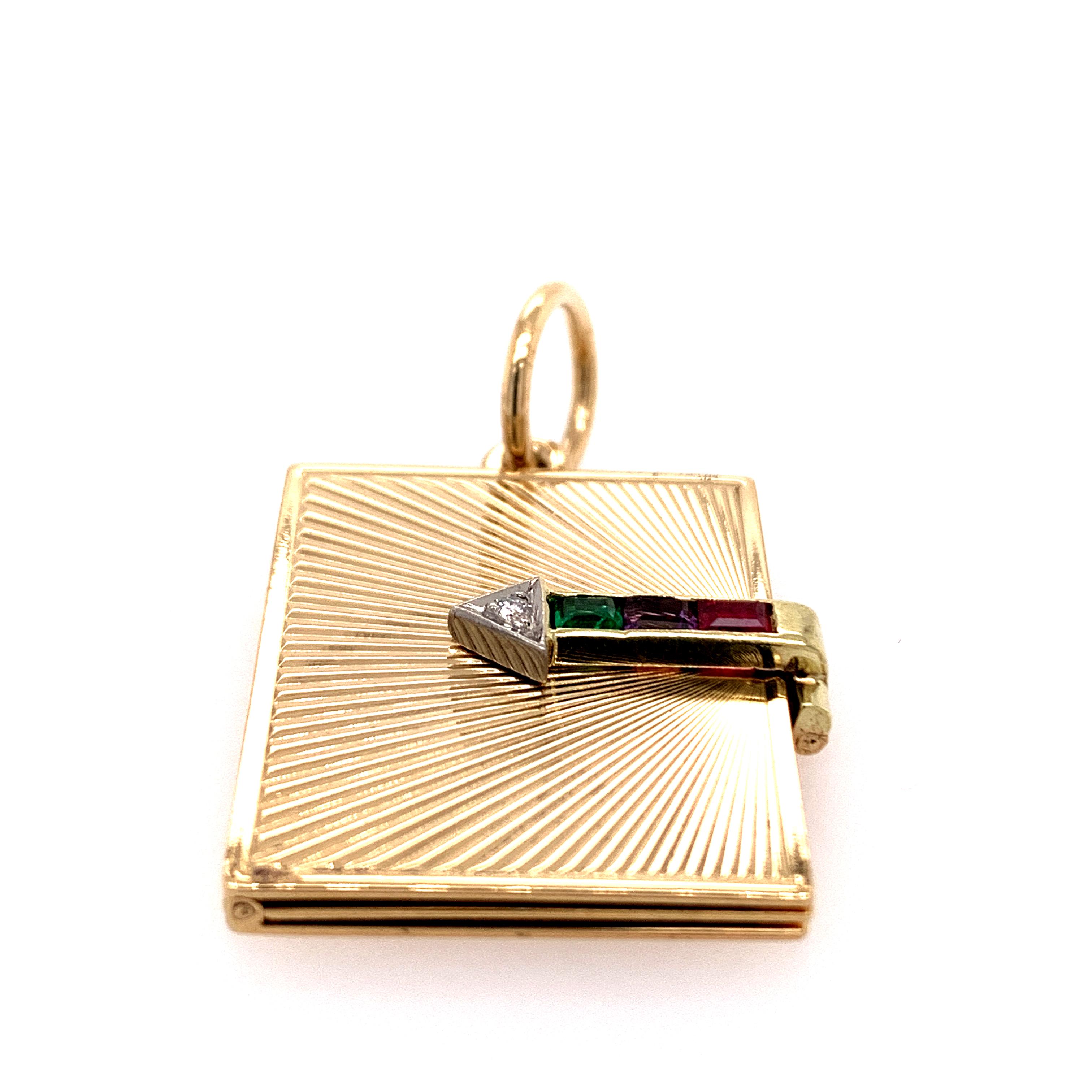 Very special rectangular book-shaped locket.  Made and signed by TIFFANY & CO.  Diagonal rayed-line 14K yellow gold background, front and back.  Opens to reveal four 