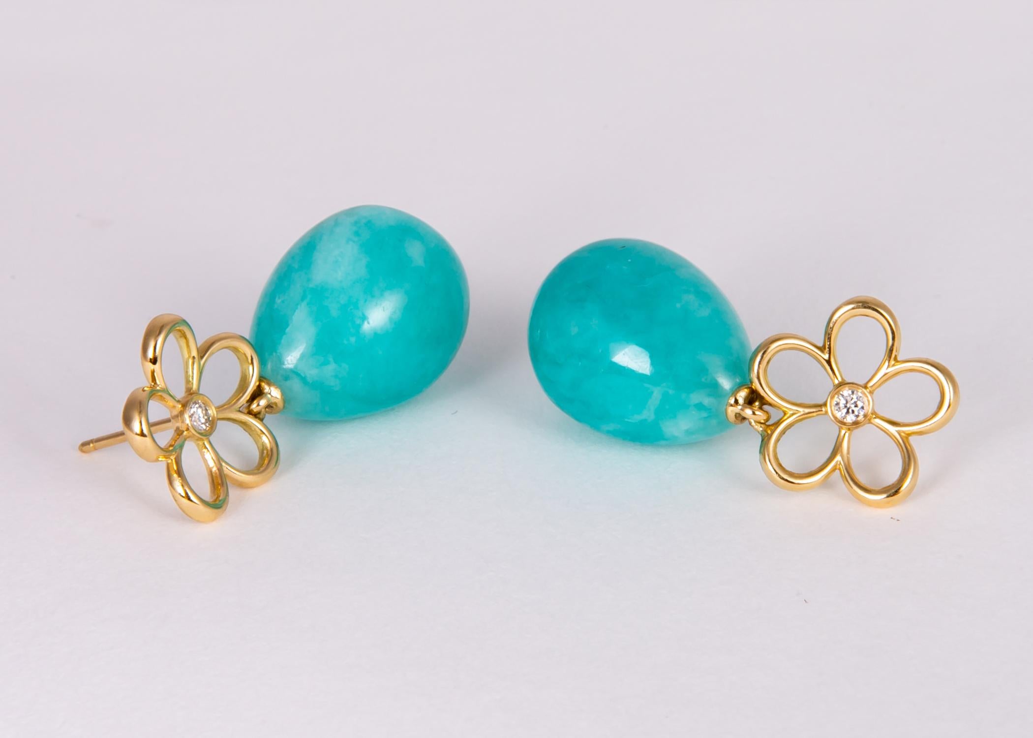 Tiffany & co. uses the simple shape of a daisy adds beautiful amazonite and a diamond to create a simple playful drop earring. 1 1/8 inches in length. 