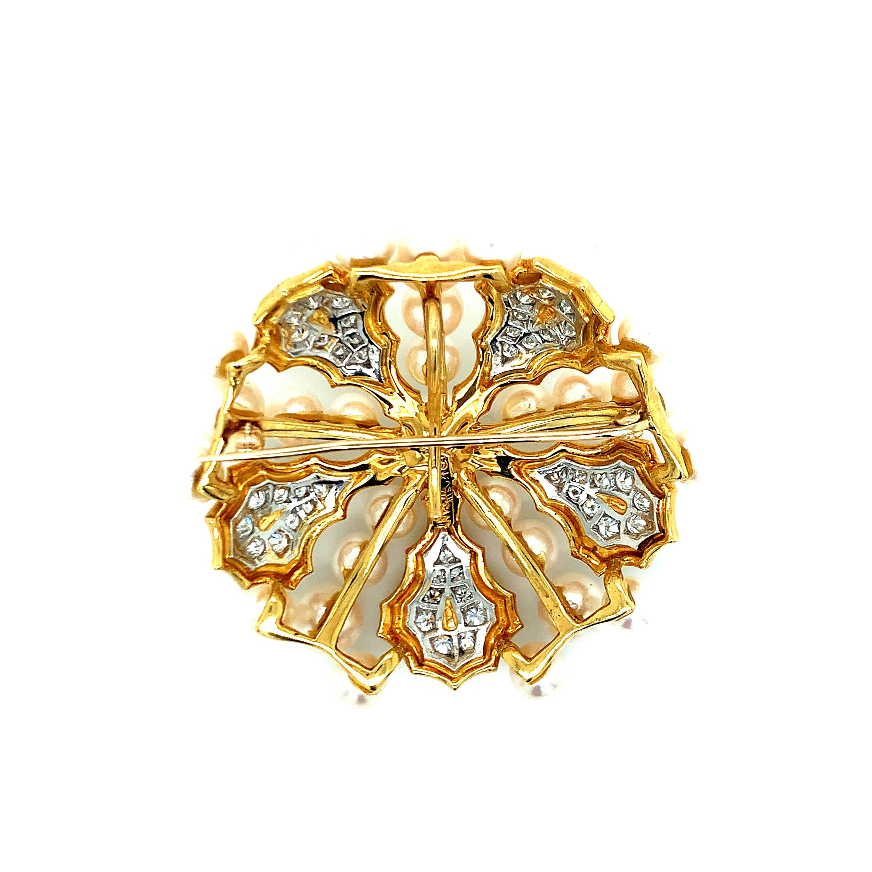 A stunning Tiffany & Co. 18 karat yellow gold diamond and pearl brooch with a radial design. Signed “TIFFANY.” Total weight: 41.0 grams. Length & width: 5.5 cm.