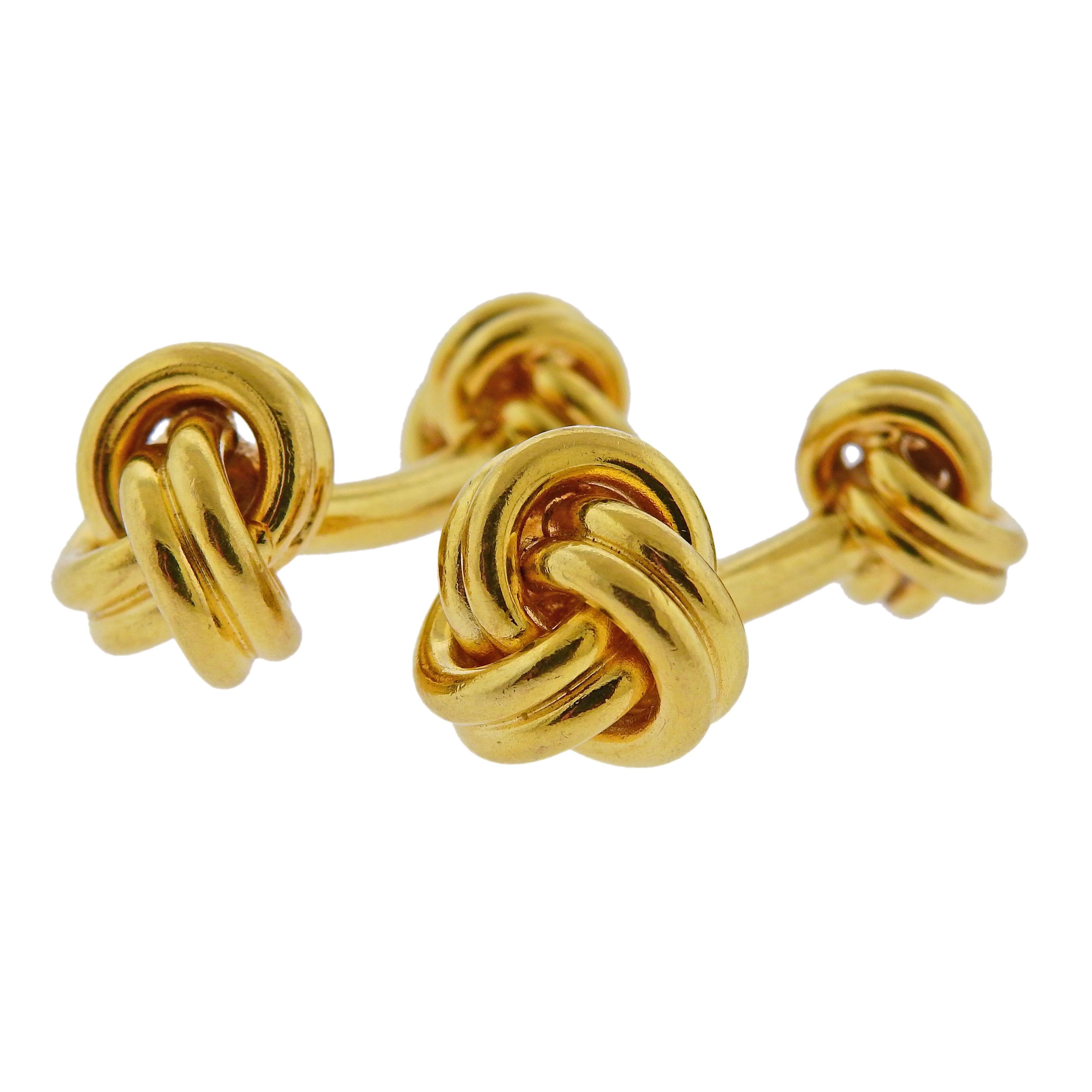 Tiffany & Co 18k gold double sided knot cufflinks. Top knot is 14mm x 13mm, small knot 11mm x 10mm. Marked Tiffany & Co,750. weight 26.7g