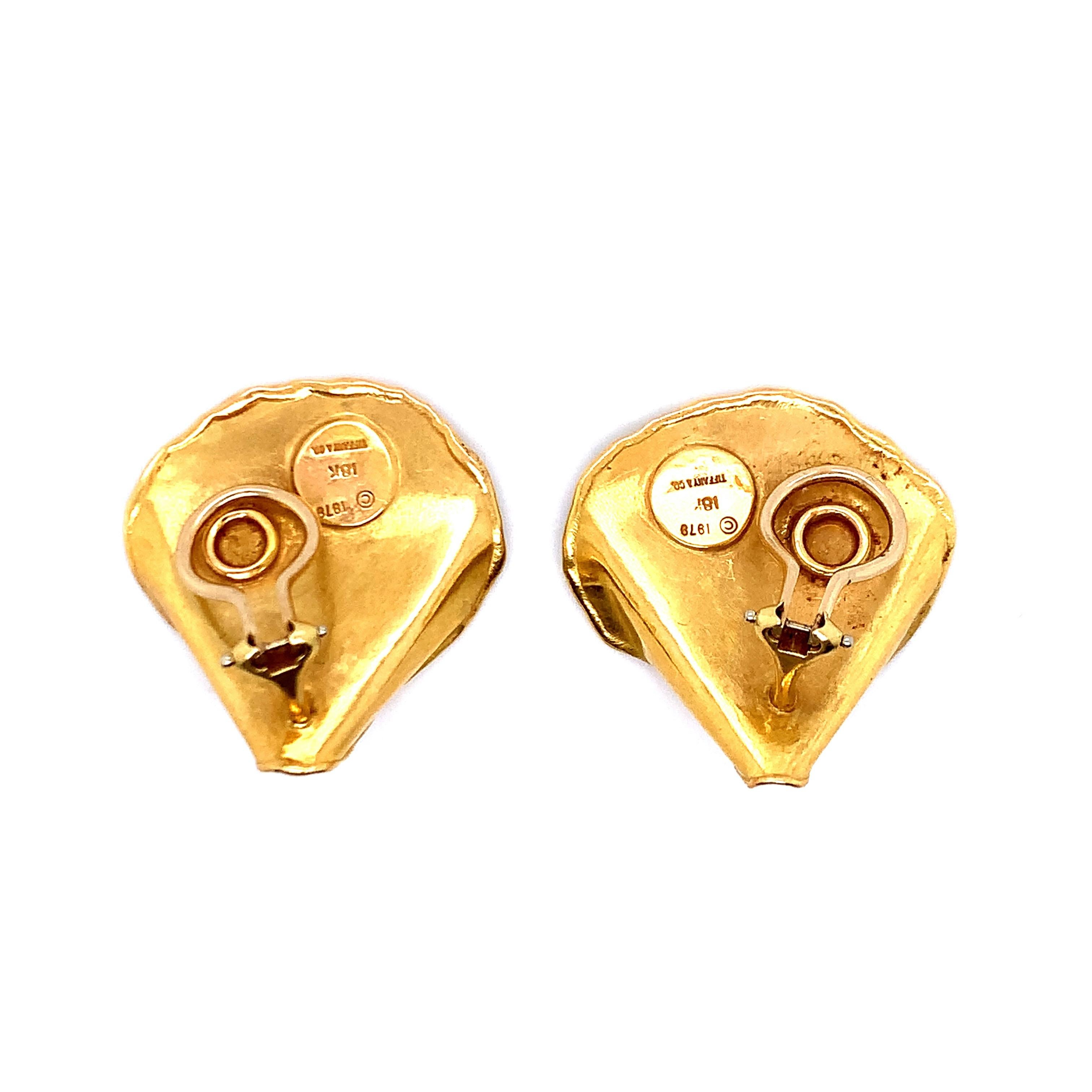 A pair of 18 karat gold ear clips, with a total weight of 10.7 grams. Signed Tiffany & Co. 