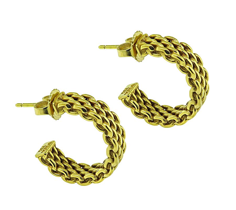 This is a gorgeous pair of 18k yellow gold earrings by Tiffany & Co. The earrings measure 19mm by 5mm and weigh 8.6 grams. The earrings are signed T&Co 750.

Inventory #13028RBB