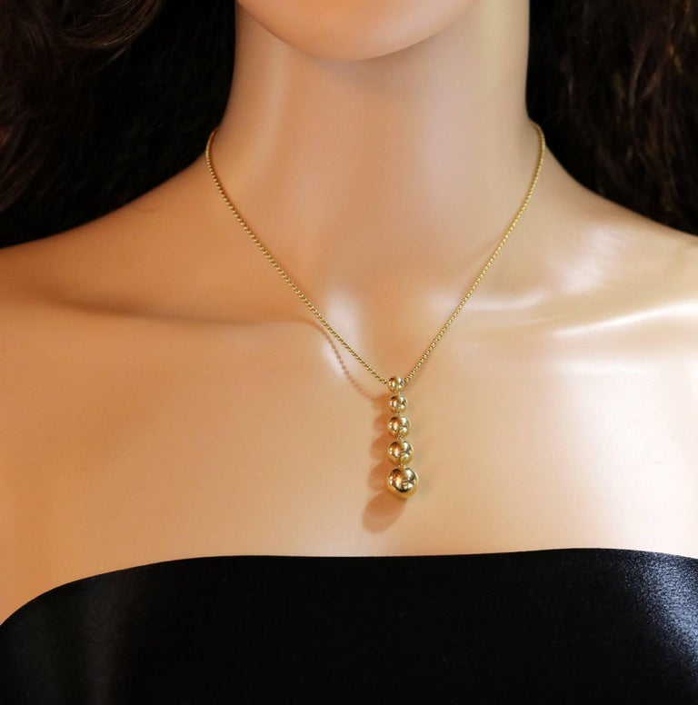 Tiffany and Co. Gold Graduated 5 Ball Pendant or Necklace For Sale at
