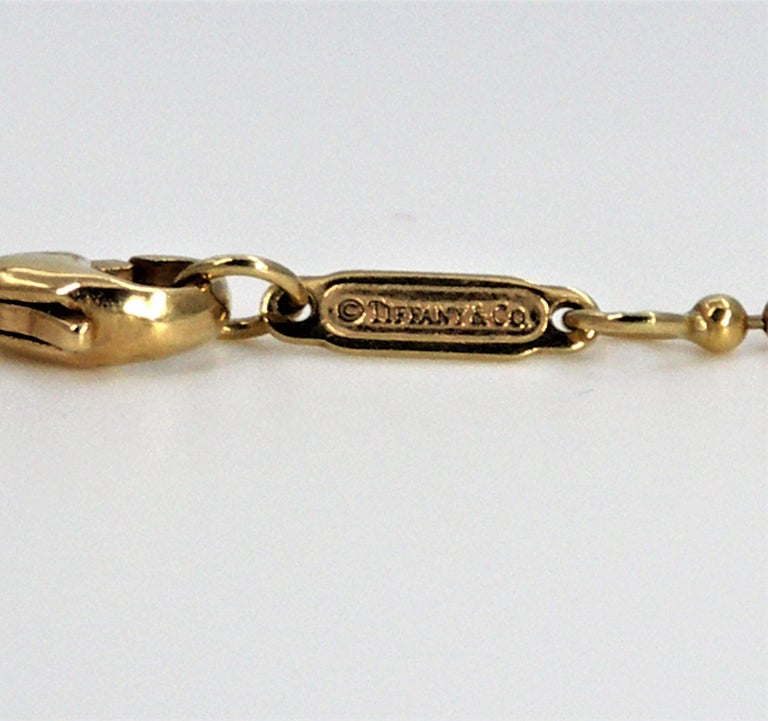 Tiffany and Co. Gold Graduated 5 Ball Pendant or Necklace For Sale at 1stDibs tiffany gold
