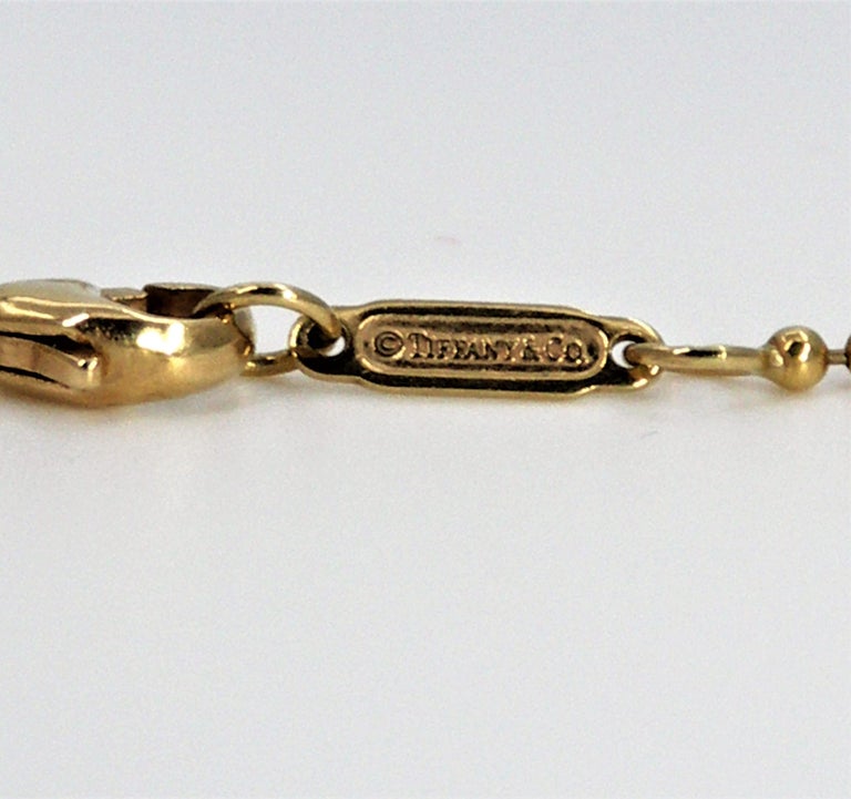 Tiffany and Co. Pendentif ou collier à 5 boules graduées en or En vente sur  1stDibs
