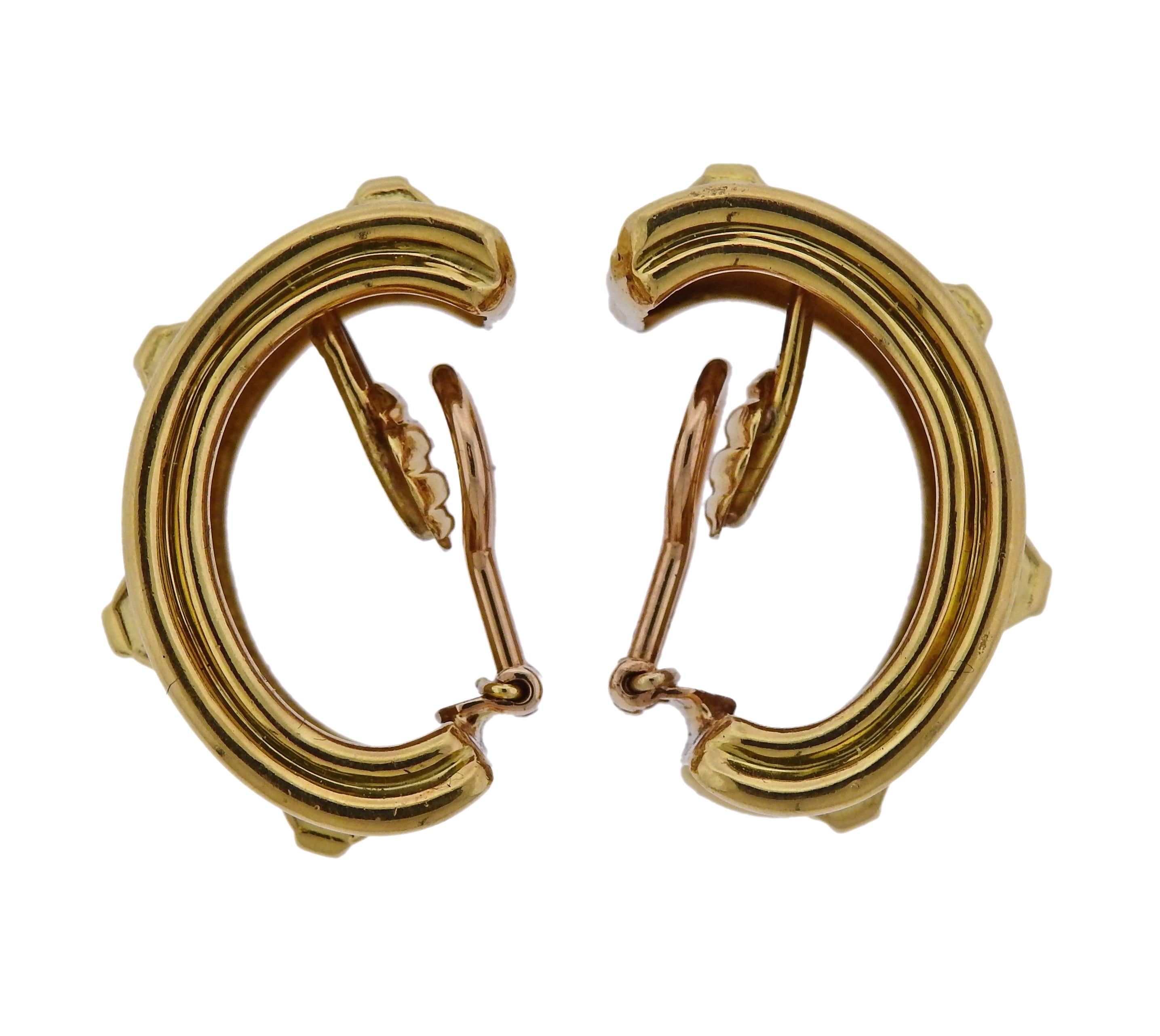 Pair of 18k gold half hoop earrings, crafted by Tiffany & Co.  Earrings are 30mm x 15mm, weigh 34.4 grams. Marked: k18, Italy, Tiffany.