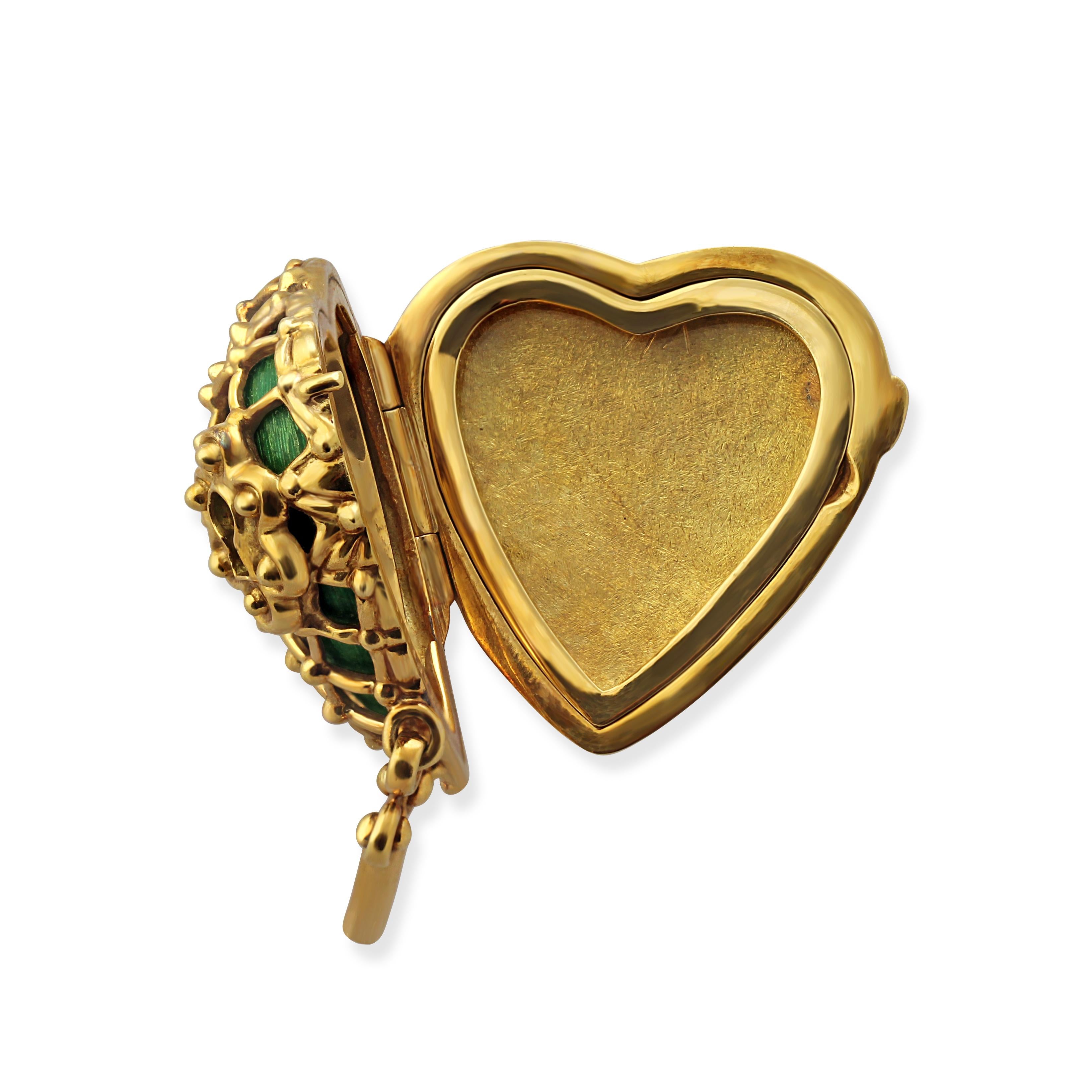 An 18k gold and green enamel heart locket brooch by Tiffany & Co. 
Note: This is a brooch and not a pendant.
Weight = 27gr
