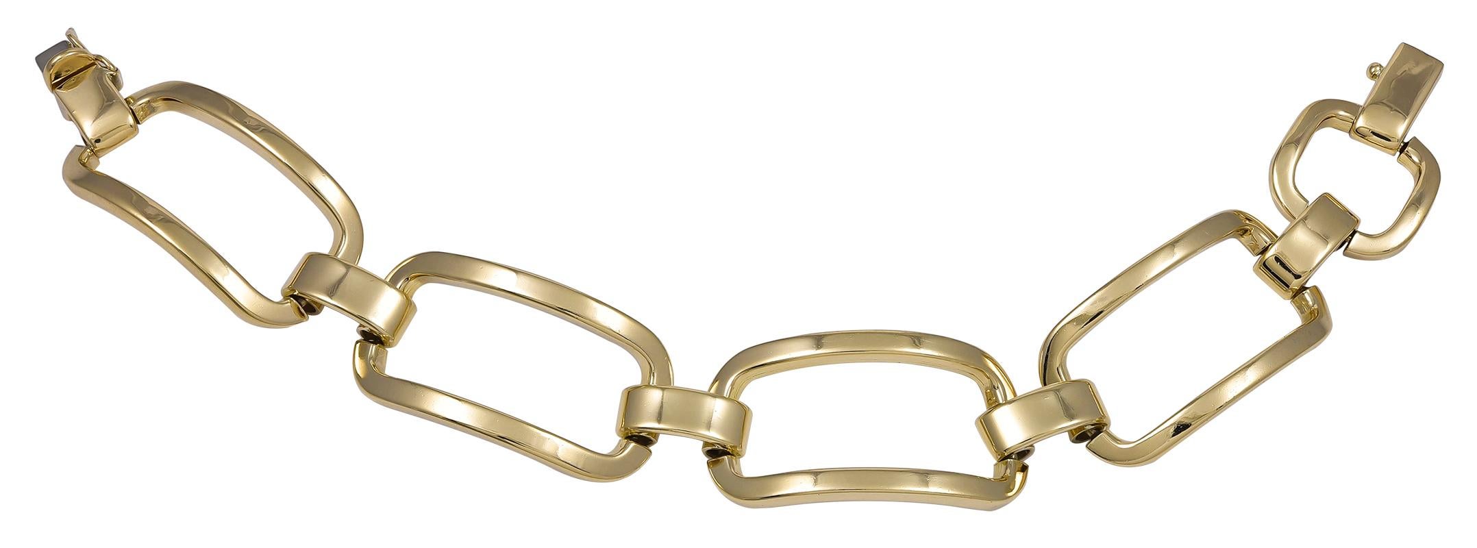 Very attractive and wearable bracelet, with curved elongated rectangular links.  Made and signed by TIFFANY & CO. 
18K yellow gold.  6 3/4