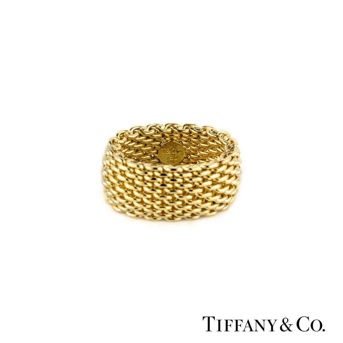 A unique 18k yellow gold Tiffany & Co. ring from the Somerset collection. The ring is made up 6 rows of intertwined woven links. The ring measures 10mm in width and is flexible. The ring is a size UK K, EU 50 and US 5 1⁄4 and has a gross weight of