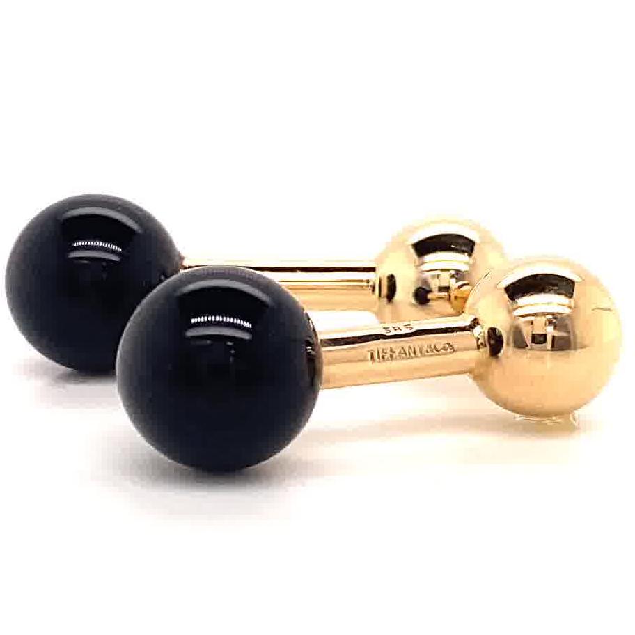 Tiffany & Co. Gold Onyx Cufflinks. Signed Tiffany & Co. Circa 1970’s.

About The Piece: Looking for a chic, sophisticated and elegant gift for a significant man in your life? You just found it. Signed by the iconic jewelry house - Tiffany & Co.