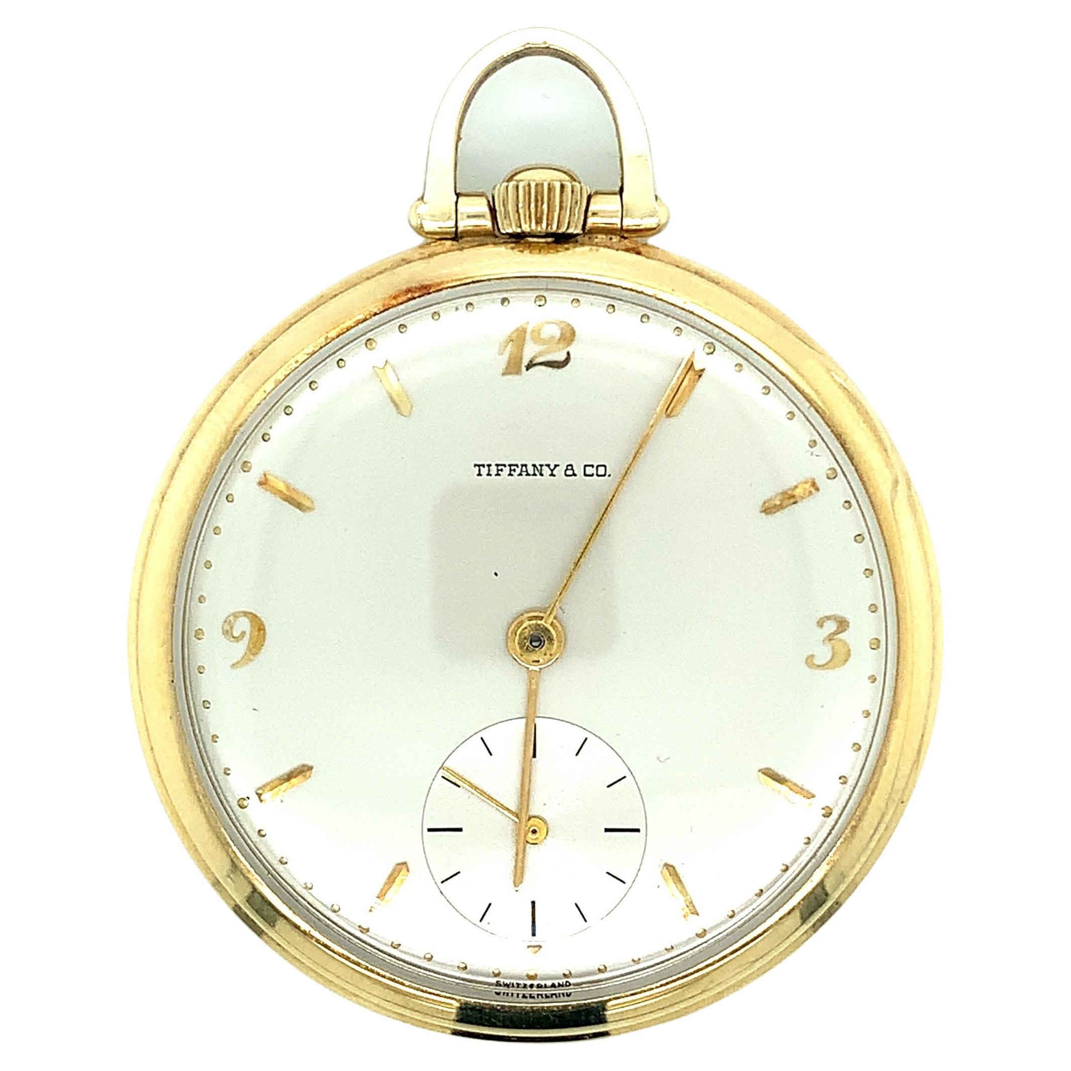 Tiffany & Co. 14 karat yellow gold pocket watch, with Movado movement. Made in Switzerland. Serial no. 550273. Marked: Tiffany & Co. / Swiss made / 17 Seventeen Jewels Unadjusted / Movado Factories / USA Movado / 14 karat gold / 550273. Total