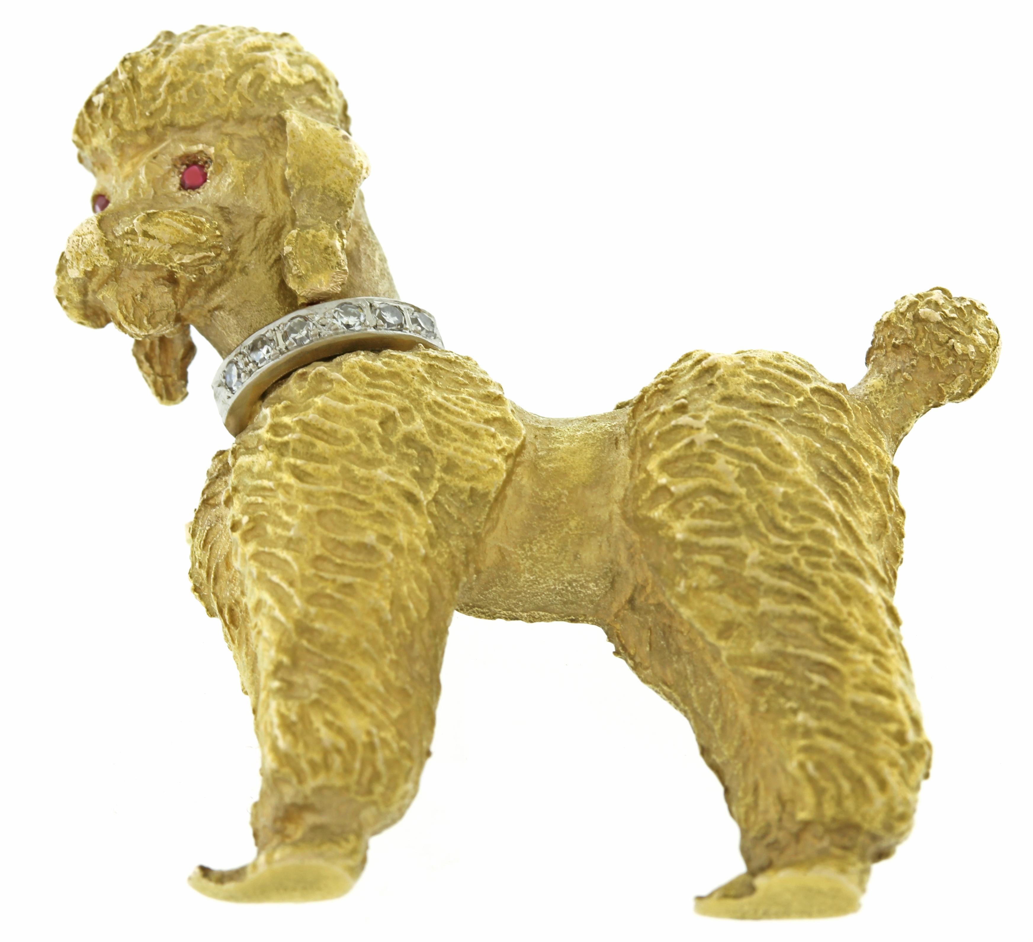 From Tiffany, this poodle brooch has a diamond and white gold collar with ruby eyes.
• Designer: Tiffany
• Metal: 14kt yellow and white gold
• Stamped and numbered: Tiffany, 10569, 14kt
• Gemstones: 6Diamonds= .03cts
                       