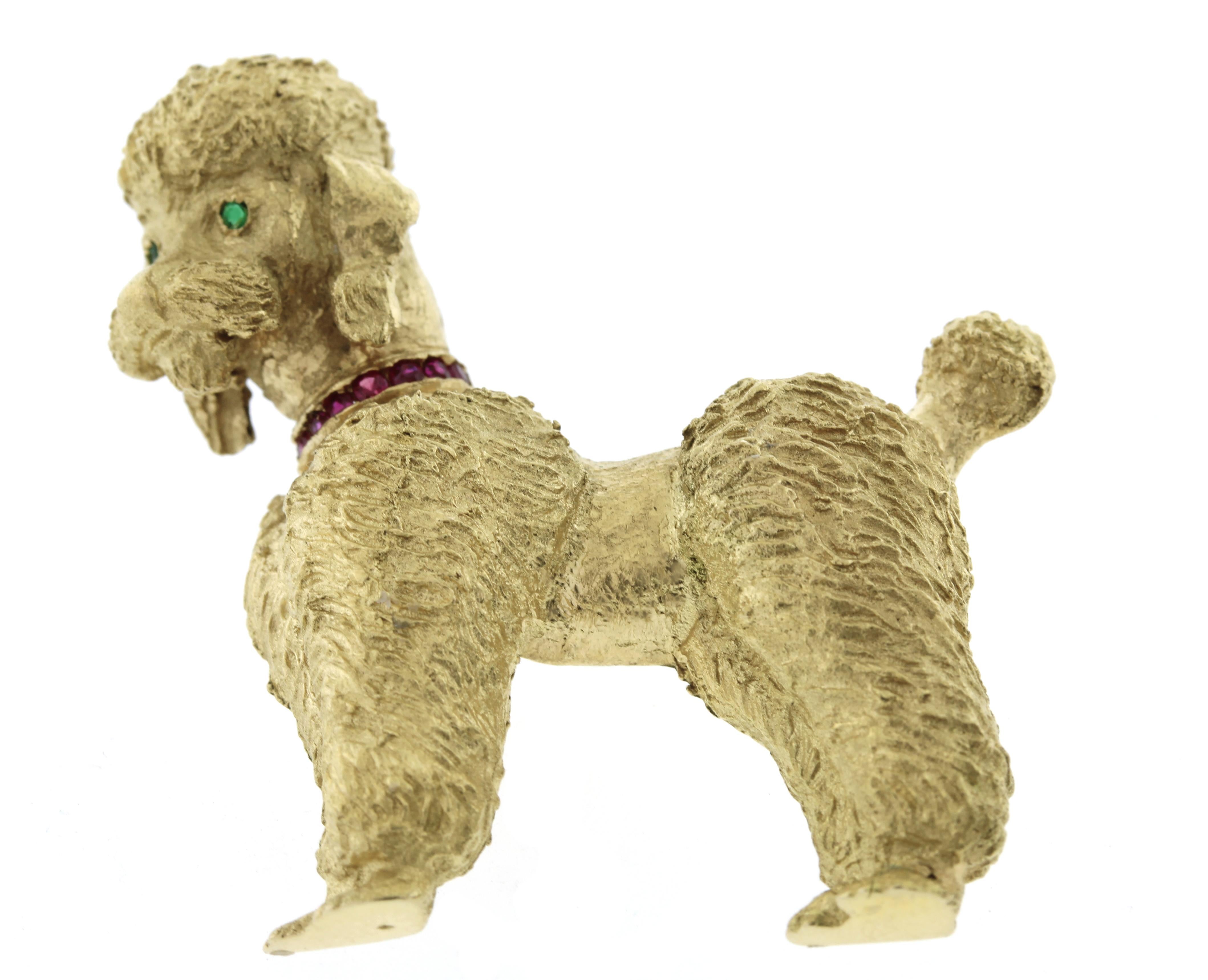 From Tiffany, this poodle brooch has a ruby collar with emerald eyes.
• Designer: Tiffany & Co
• Metal: 14kt yellow gold
• Stamps: Tiffany, 14kt
• Gemstones: 6 Rubies and  2 Emeralds
• Dimensions: 1.5 by 1.25 inches
• Circa:1950s-1960s
• Packaging: