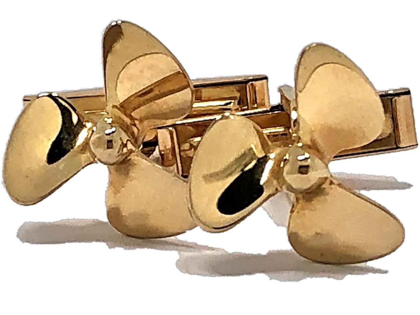 Made by Tiffany & Co, these 14K Yellow Gold Cufflinks in the shape of propellers are
ideal for any man who is an avid boater. The fold down backs make them easy to put on and to take off. Stamped TIFFANY & CO 585. The propellers measure 5/8 inch