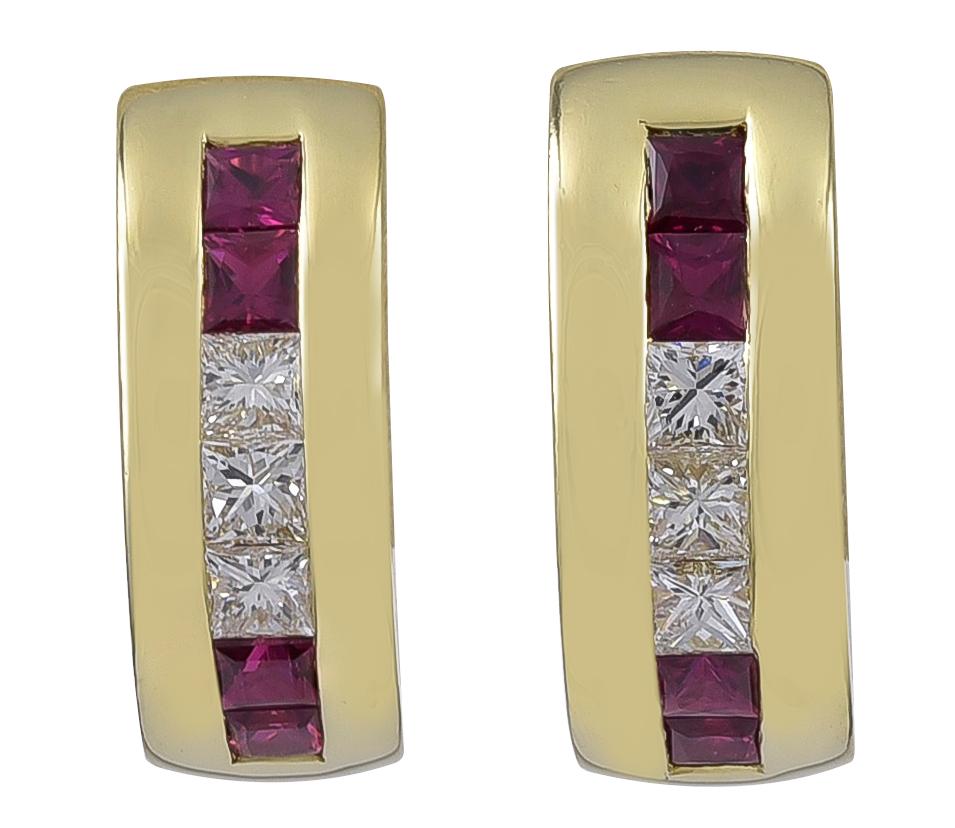 Chic half-hoop earrings.  Made and signed by TIFFANY & CO.  18K yellow gold, set with sparkling princess-cut diamonds and square step-cut rubies.  3/4