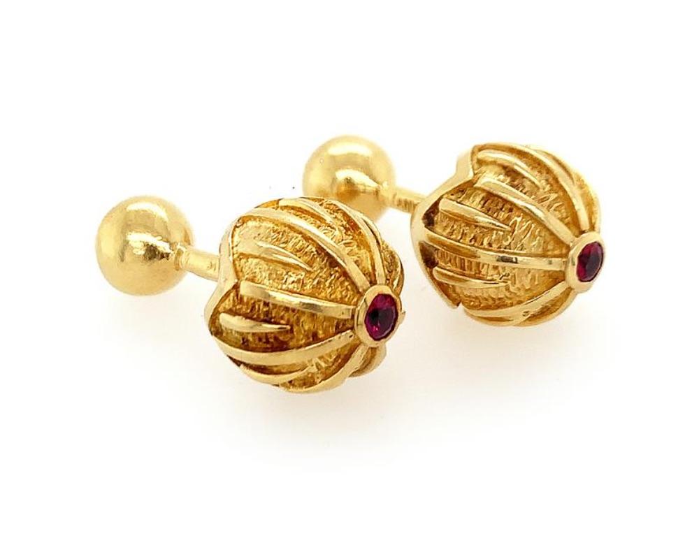 18K Y/gold ruby cufflinks, stamps TIFFANY 18K measures 5/8 inch in diameter, weight 18.4 dwt

