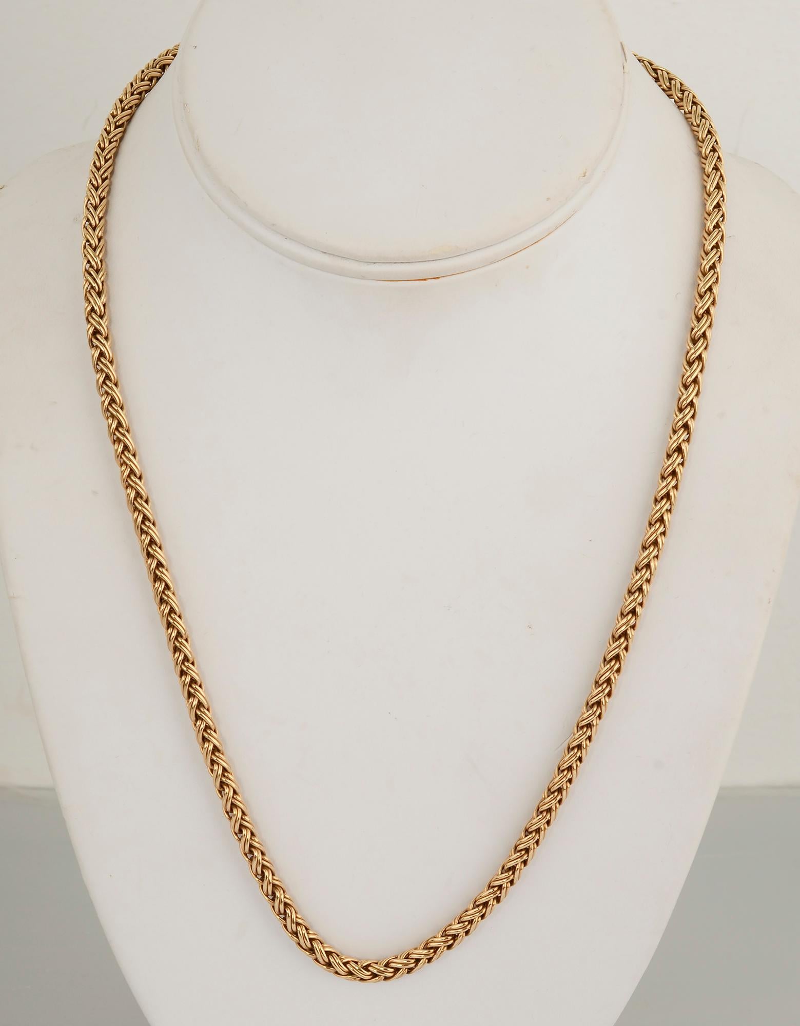 Beautifully woven wheat chain necklace by Tiffany. The necklace is totally in the round as is the tubular shaped push clasp. The chain is 20 1/2 inches long and 3/8 