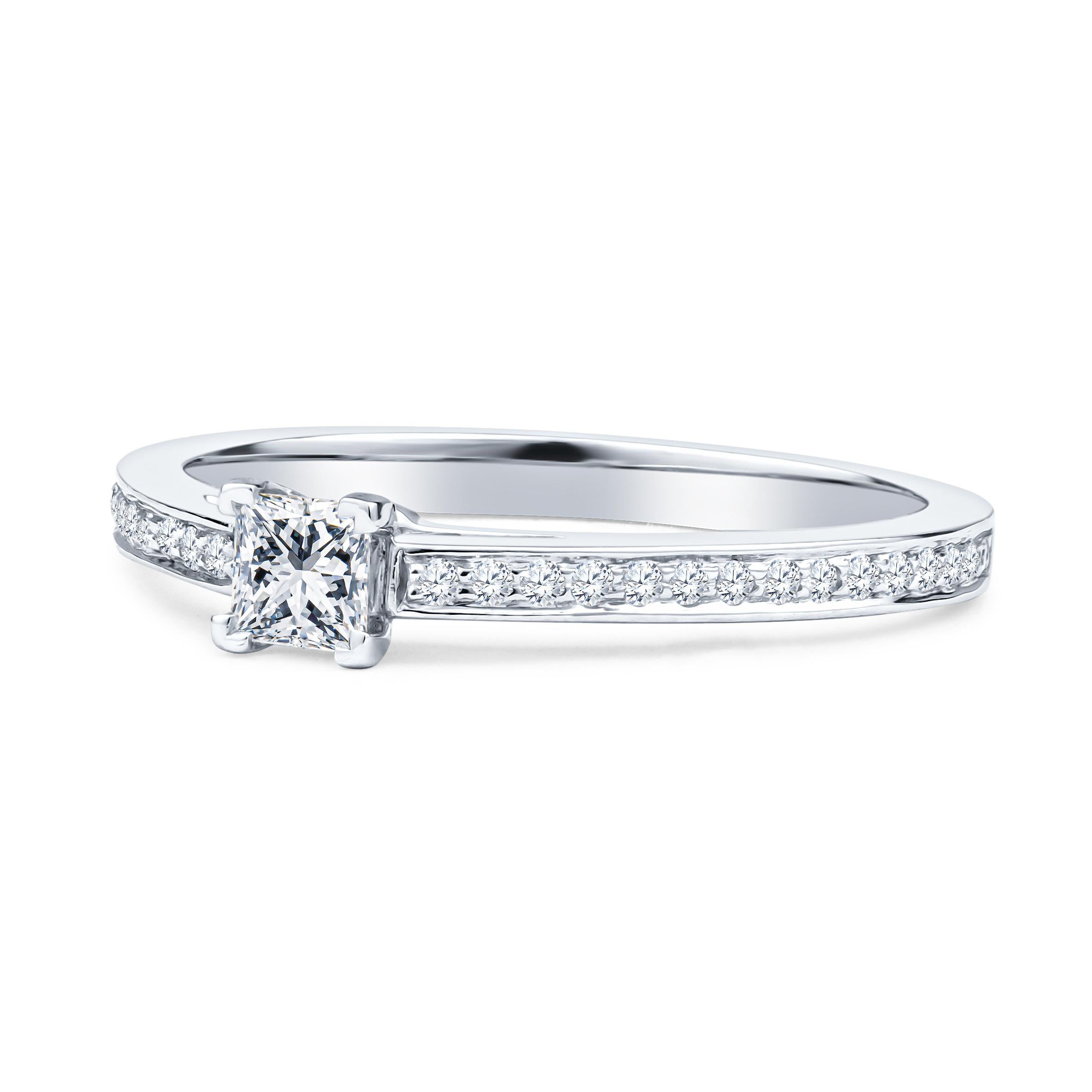 This dainty Tiffany & Co. design is the Grace Diamond Ring, featuring an approximately 0.17ct princess cut diamond center, with about 0.19ctw in round accent diamonds, set in a platinum ring. The diamonds are of D-F color, VS1-VVS1 clarity. This