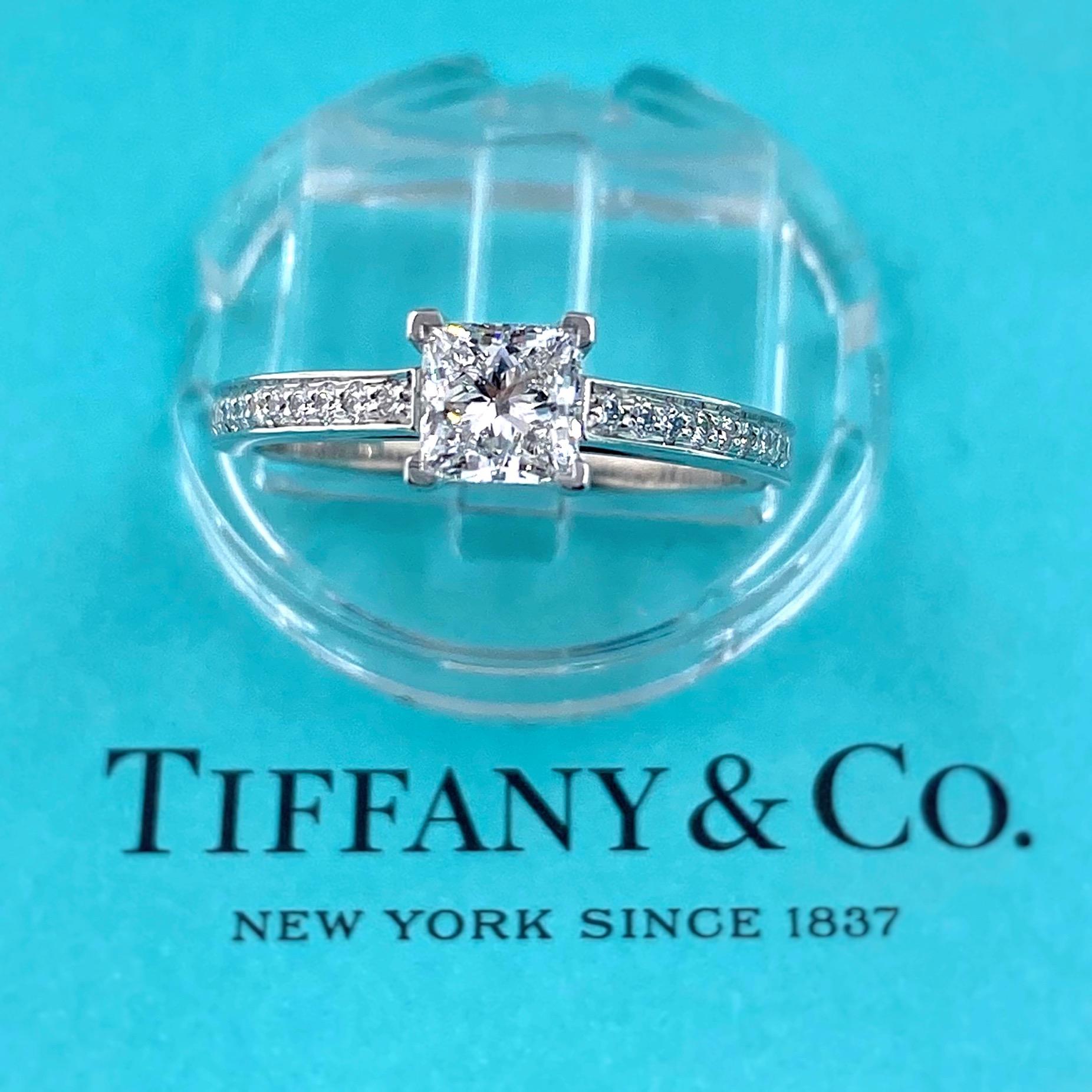 TIFFANY & CO. Grace Princess Diamond Engagement Ring
Style:  GRACE - Solitaire with Diamond Band
Ref. number:  27891306/L03160555
Metal:  PT950
Size:  5.5 - sizable
TCW:  0.76 tcw
Main Diamond:  Square Modified Brilliant ( Princess Cut ) Diamond
