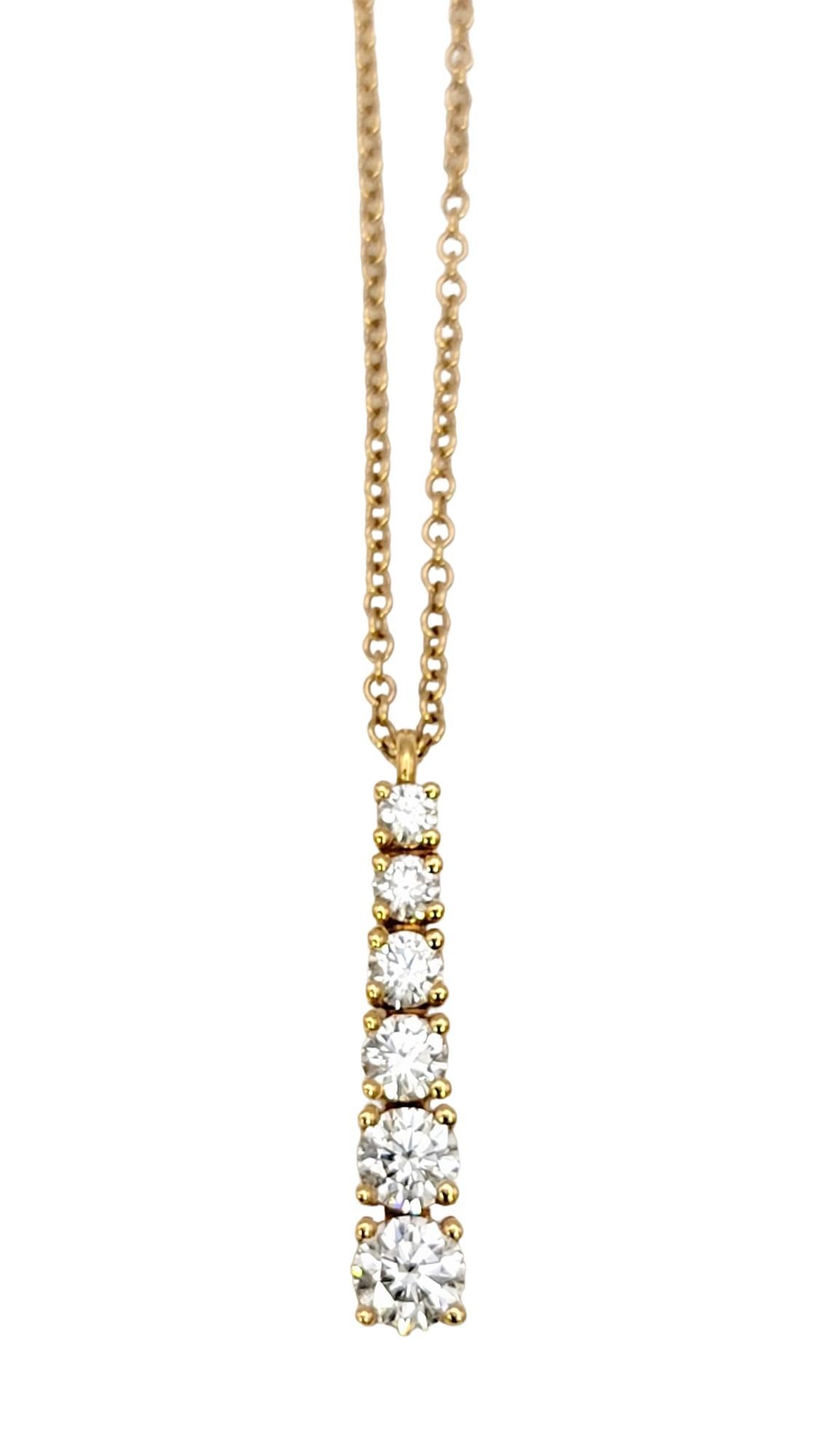 This lovely graduated diamond pendant necklace from Tiffany & Co. is stunningly simple, yet impressively elegant. This is one of those necklaces that you will never want to take off!  Featuring a delicate rose gold chain and a graduated drop of