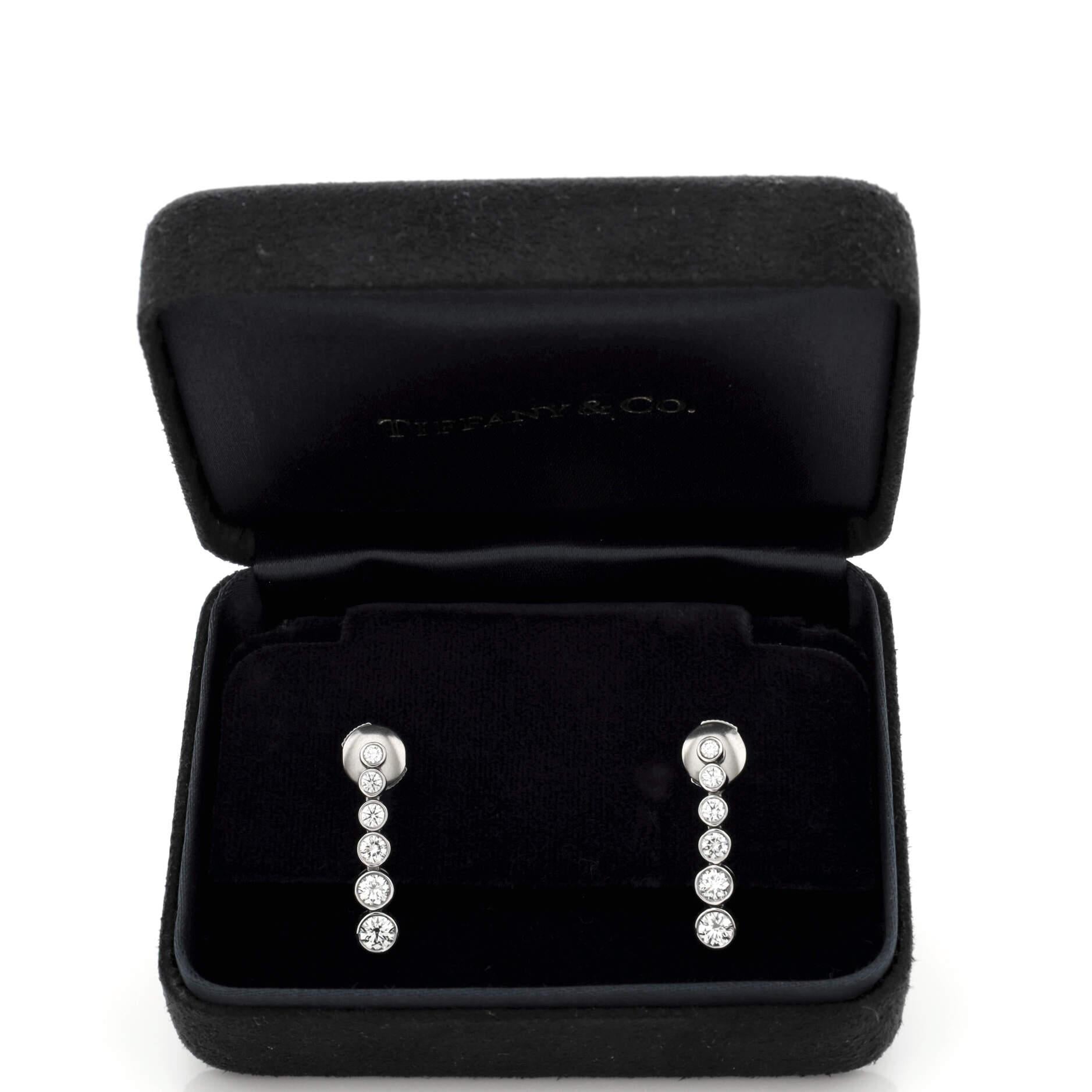 Condition: Great. Minor wear throughout.
Accessories:
Measurements: Height/Length: 22.25 mm, Width: 4.60 mm
Designer: Tiffany & Co.
Model: Graduated Jazz Drop Earrings Platinum and Diamonds
Exterior Color: Silver
Item Number: 220029/39