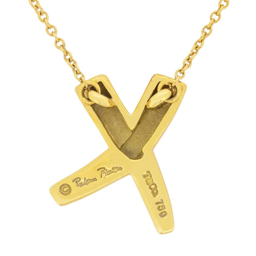 Tiffany & Co. Picasso Paloma's 'Graffiti X' Necklace in 18 carat yellow gold. The classic design sits on the original 18 carat yellow gold chain, and all Tiffany & Co. markings are present. This necklace would make a lovely gift!  
Metal: 18ct