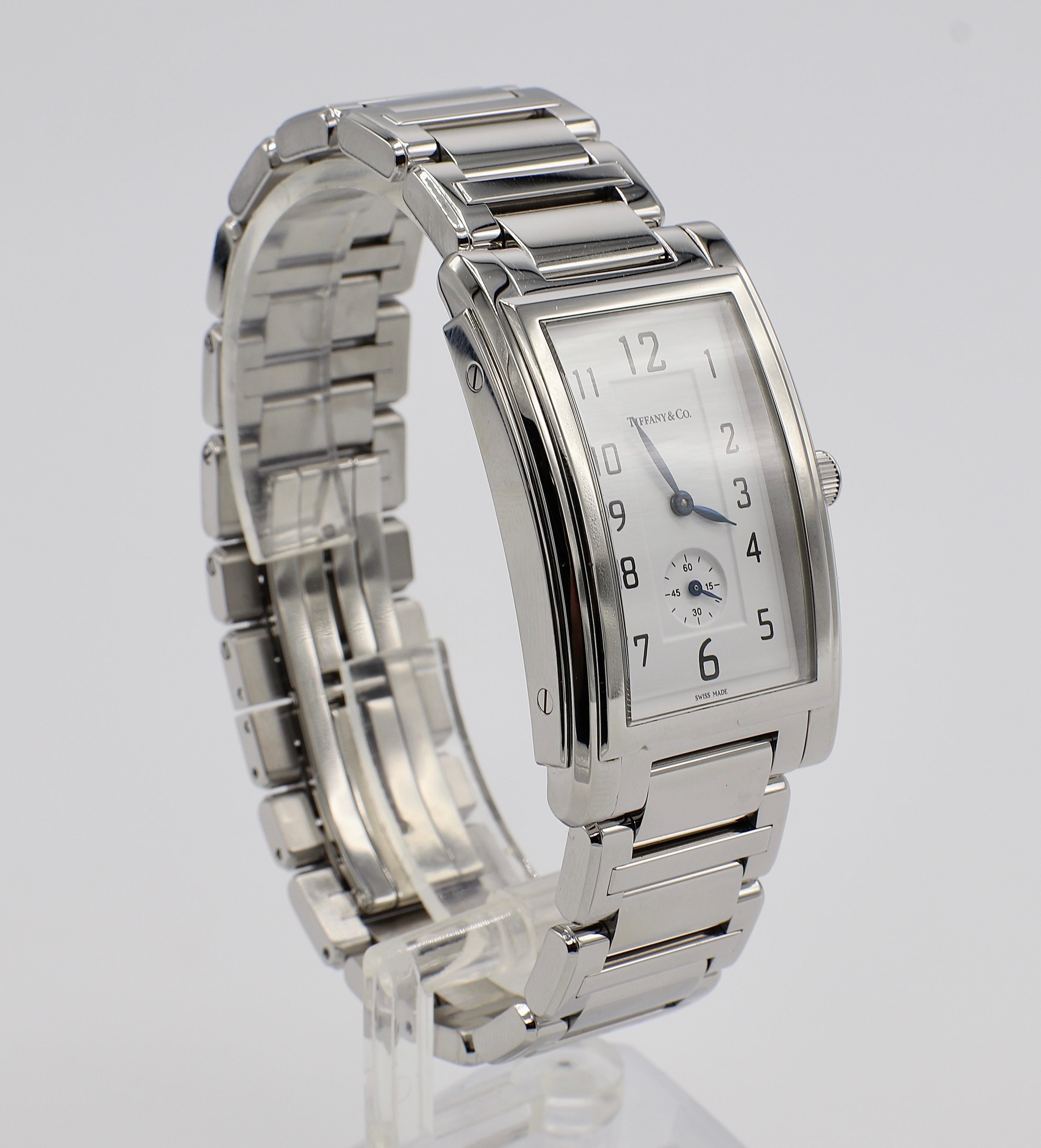 Tiffany & Co. Grand Quartz Resonator Quartz Stainless Steel Watch
Metal: Stainless Steel
Movement: Quartz (battery)
Case: 27 x 43mm
Dial: White
Swiss Made

