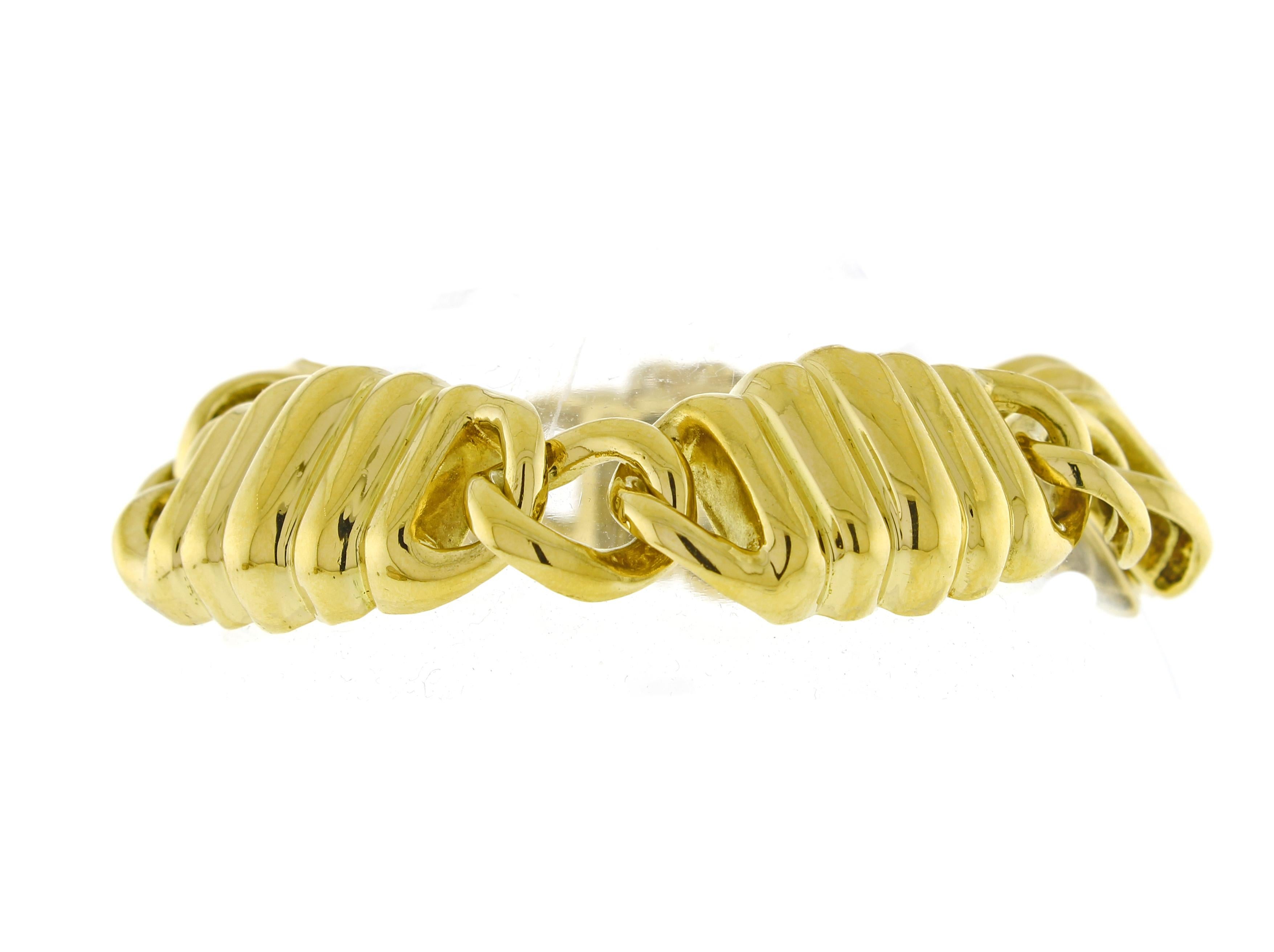 From Tiffany & Co., a wide grooved link bracelet.
♦ Designer: Tiffany & Co.
♦ Metal: 18 karat
♦ Circa 1980s
♦ 7½ inches long ¾ wide
♦ 51.8 grams
♦ Packaging: Pampillonia presentation box
♦ Condition: Excellent , pre-owned
♦ Price: Based on the