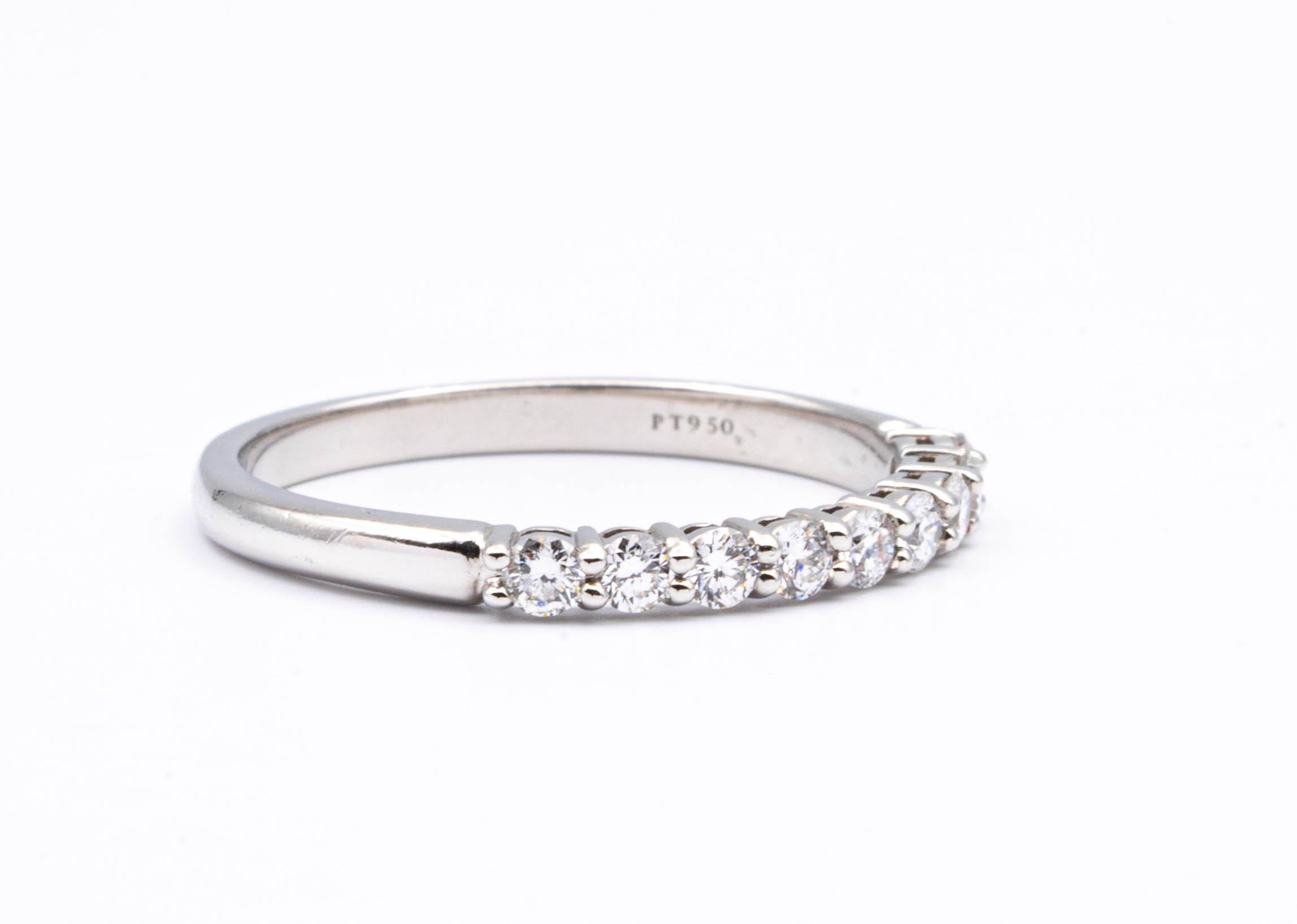 Tiffany & Co. Embrace Half Band ring finely crafted in platinum with 9 Round Brilliant cut diamonds weighing .27 carats total weight. 

Stamp: Tiffany & Co. PT950
Size: 6.5 ( can be re-sized)
Includes Tiffany outer Box and inner box
Retail :
