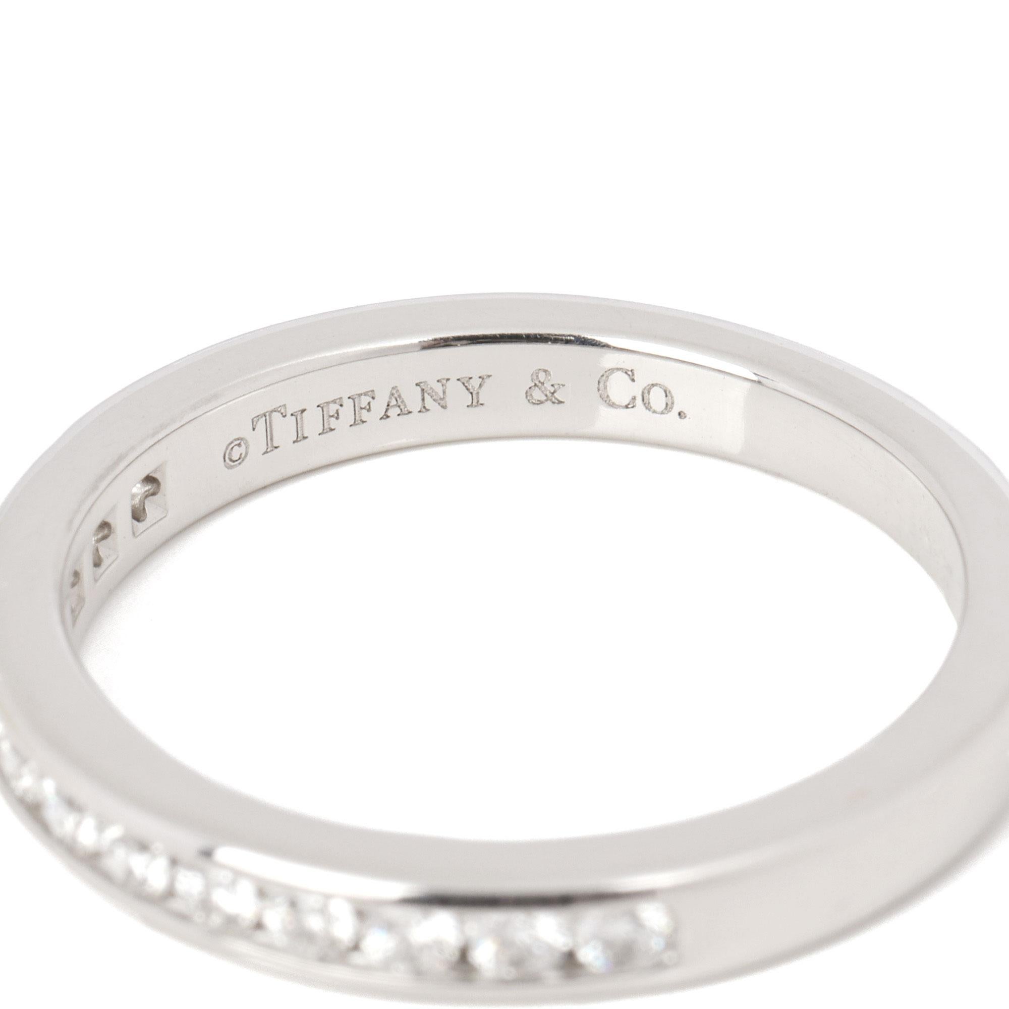 This ring by Tiffany & Co. features round brilliant cut diamonds in a half eternity design. 
RRP	£2,575
ITEM CONDITION	Excellent
MANUFACTURER	Tiffany & Co
GENDER	Women's
UK RING SIZE	H
EU RING SIZE	46
US RING SIZE	3.75
BAND WIDTH	2.5mm
TOTAL