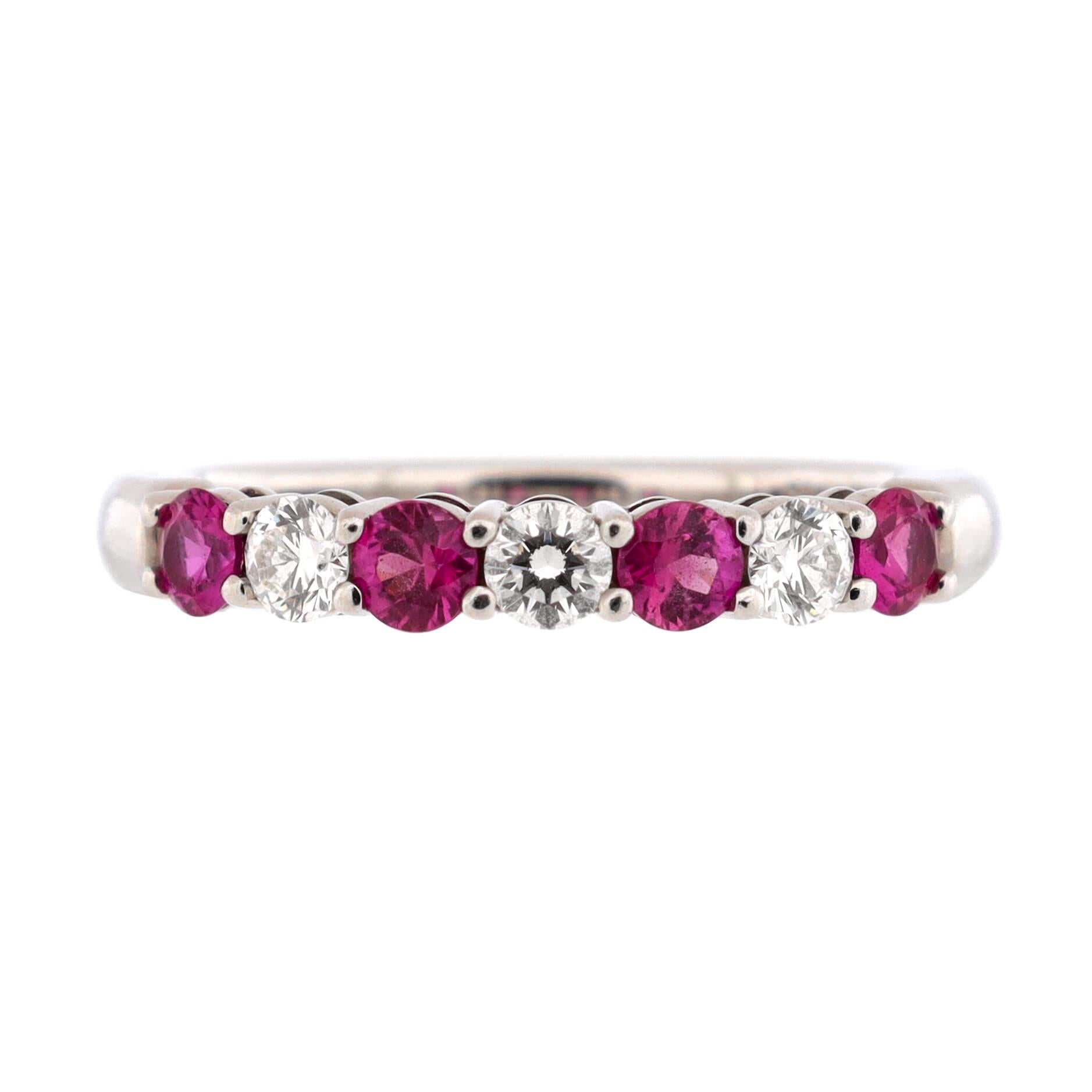 Condition: Very good. Moderate wear throughout.
Accessories: No Accessories
Measurements: Size: 6, Width: 2.20 mm
Designer: Tiffany & Co.
Model: Half Embrace Band Ring Platinum with Diamonds and Pink Sapphires 3mm
Exterior Color: Silver
Item Number: