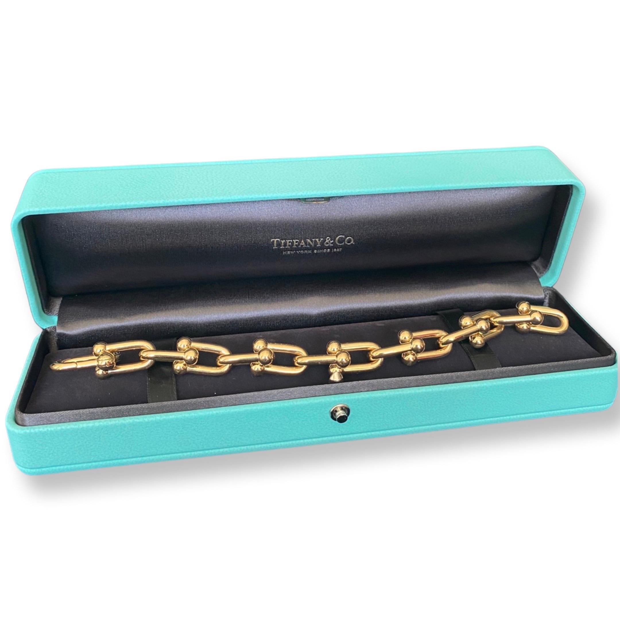 Tiffany Co Hardware large link bracelet 
size small 
18 k gold yellow gold chain links 
Condition: excellent , no defects 
Purchased in December 2022

Comes with: 
Tiffany Leather blue box
Tiffany Paper outer blue box
Copy of the proof of purchase