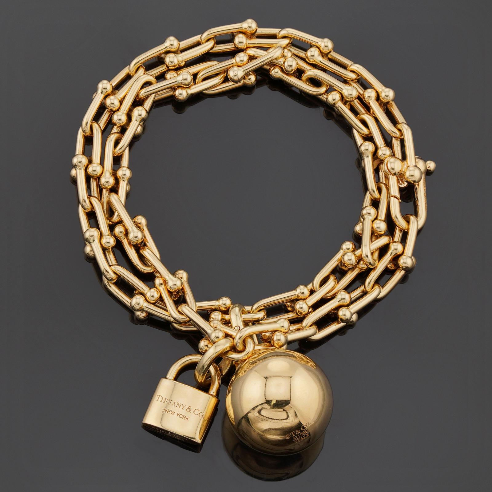 This authentic small Tiffany & Co. two-row bracelet is crafted in 18k yellow gold and features bold chain of gauge links completed with a ball and lock. Fits wrists up to 6.25 inches in length. Designed to be comfortable and easy to wear. Made in
