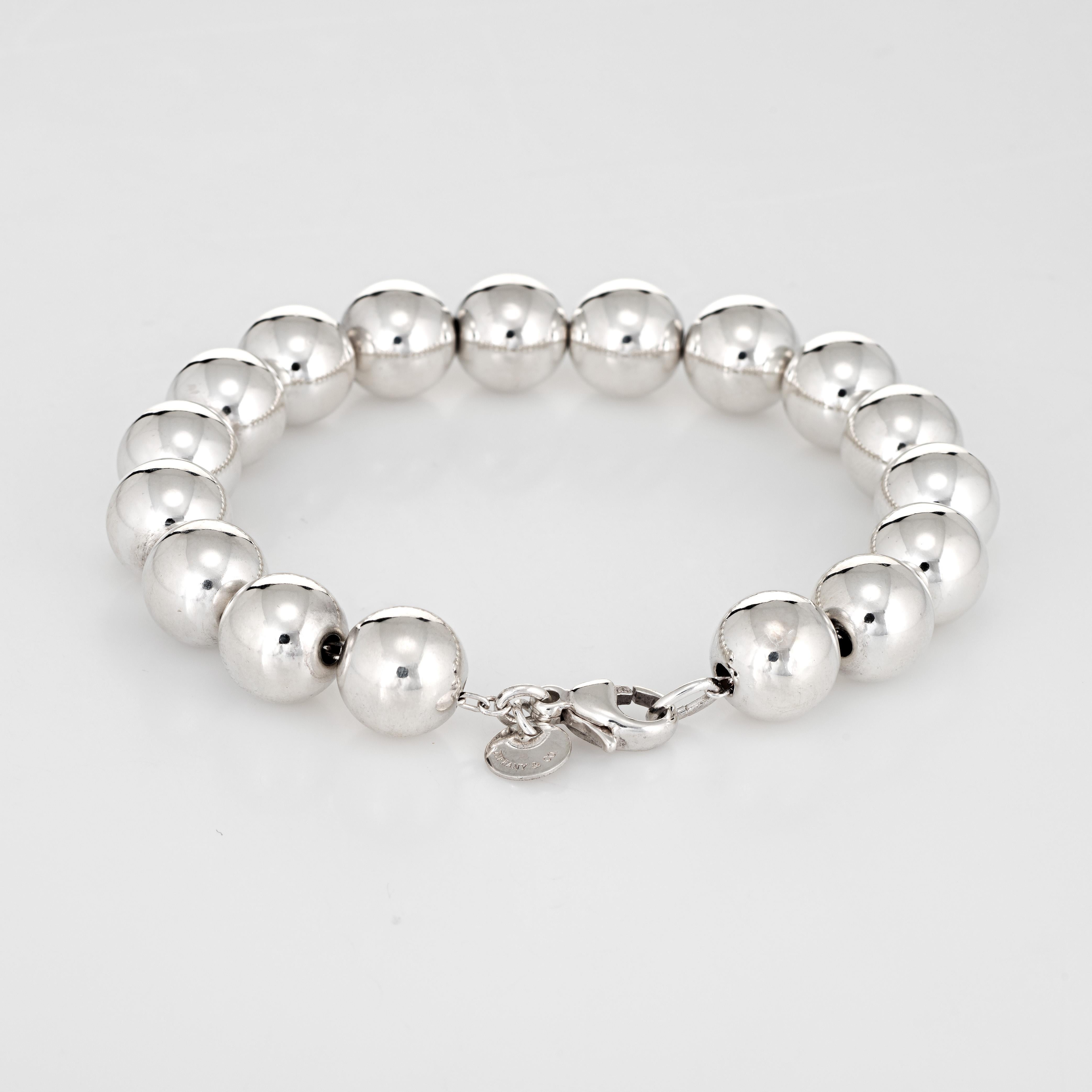 Stylish pre owned Tiffany & Co silver bead bracelet crafted in 925 sterling silver.  

The bracelet features silver beads that are uniform in size (9mm).

The bracelet is in excellent condition and was recently professionally cleaned and polished.