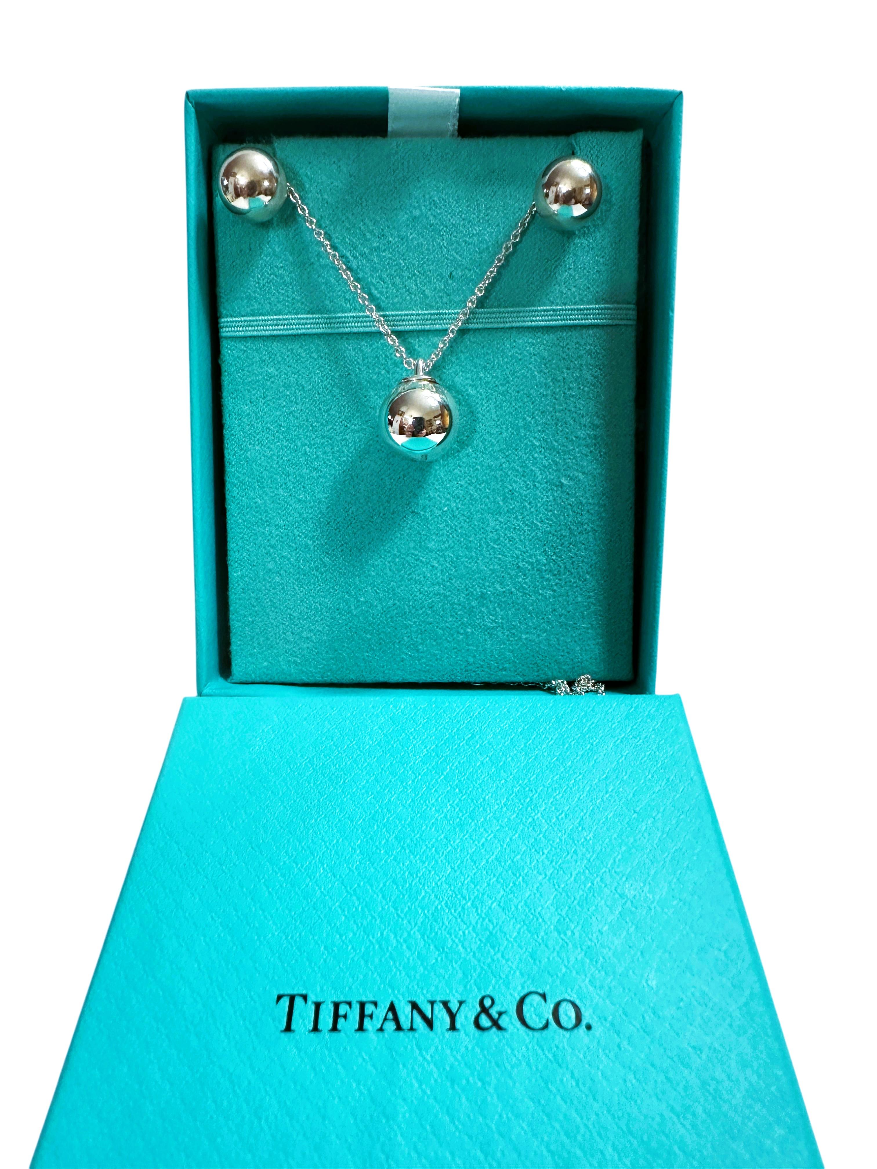 This is a Tiffany & Co. 12.5 mm HardWear Ball Sterling Silver Pendant Necklace and Tiffany & Co. 10 mm HardWear Ball Sterling Silver Post Earrings.  What a beautiful set!!  It comes in the original box.  It is sleek, simplistic, perfect for