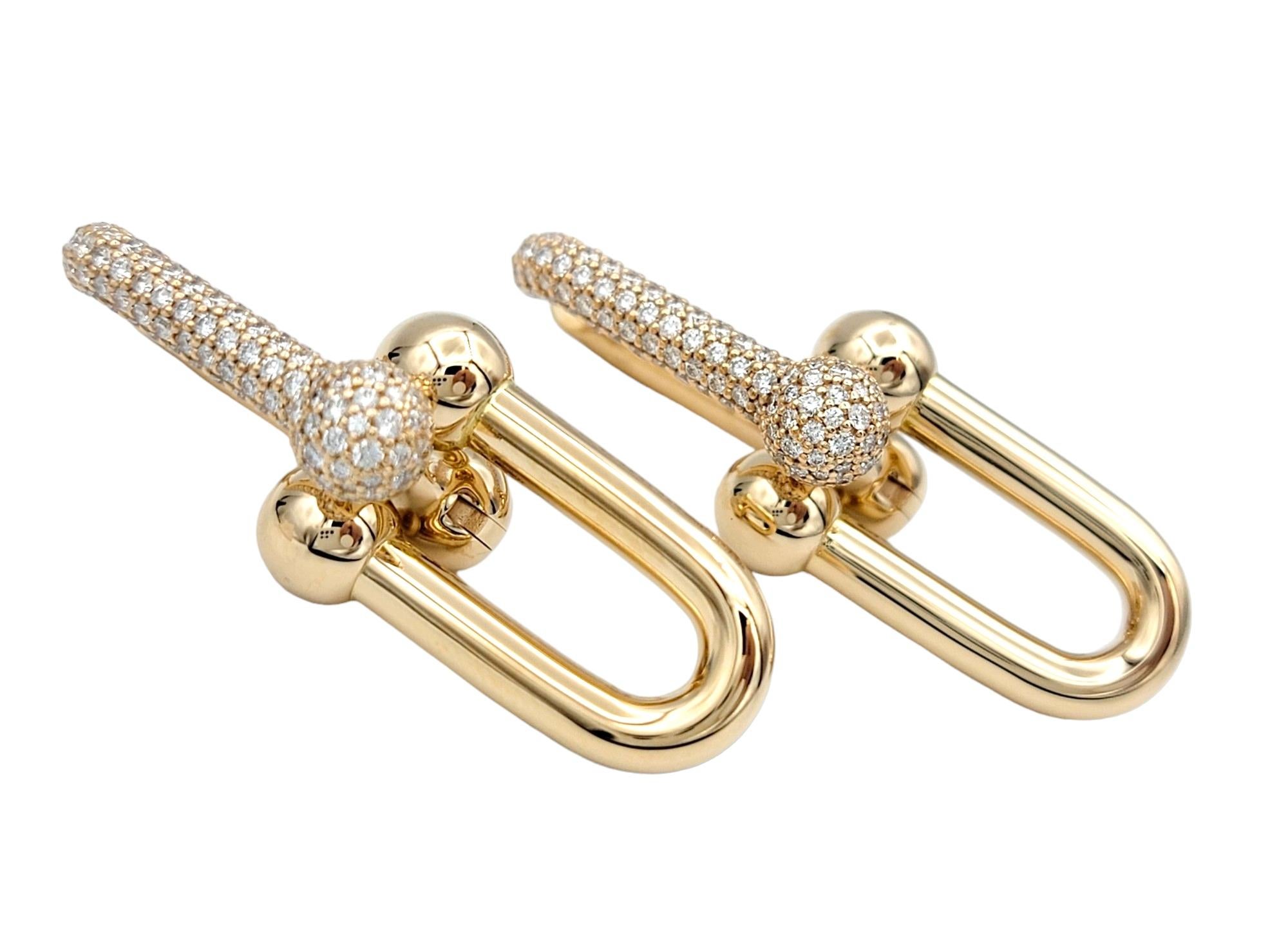 These incredible Tiffany & Co. earrings from their coveted HardWear Collection are a striking testament to modern elegance. The use of 18 karat rose gold adds a contemporary warmth to the design, enhancing the overall allure of the piece. The