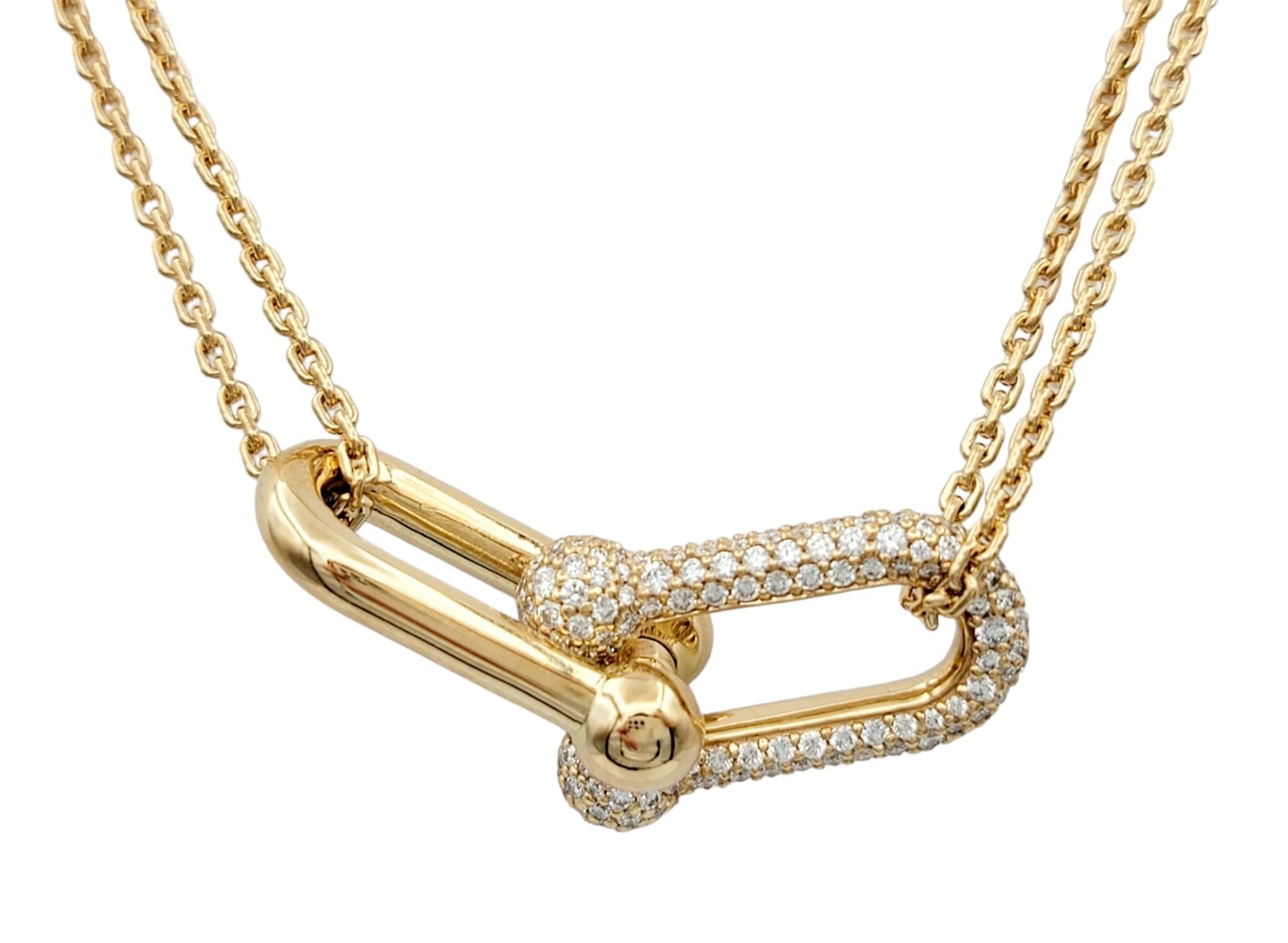 The Tiffany & Co. HardWear Collection exudes a captivating allure with this incredible gold and diamond necklace. Crafted in lustrous 18 karat rose gold, this necklace features a distinctive double-link pendant design suspended from a gracefully