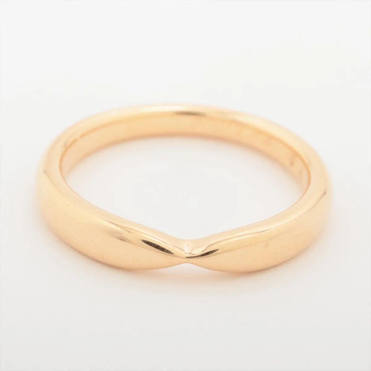 The Tiffany & Co. Harmony Band Ring in gold is a timeless symbol of elegance and commitment. Crafted from polished gold, its sleek, slightly tapered design offers a refined and comfortable fit. Minimalist yet sophisticated, the smooth surface and
