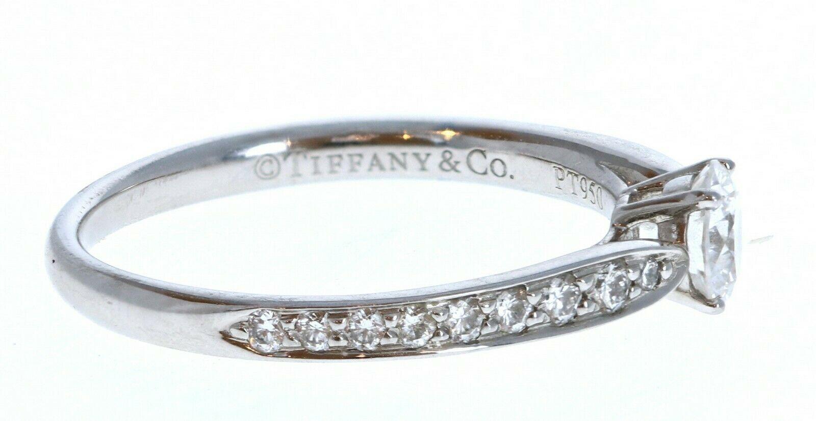 Tiffany & Co Harmony Platinum & Diamond Engagement Ring 0.32ctw 

For sale is a Tiffany & Co Harmony platinum and diamond engagement ring. 
The center stone is 0.32 ct round brilliant cut diamond H VVS1
The mounting is comprised of approx.0.15 cts.