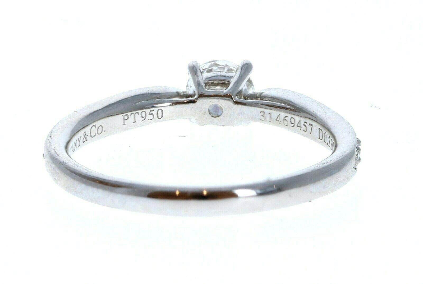 Tiffany & Co Platinum & Diamond Engagement Ring 0.33ctw F VVS2 


For sale is a Tiffany & Co platinum and diamond  engagement ring. 
The center stone is 0.33 ct round brilliant cut diamond F, VVS2
The mounting is comprised of approx. 0.25 cts. of