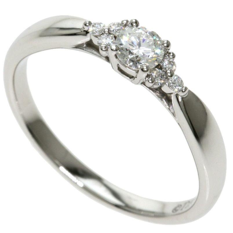 TIFFANY & Co. Harmony Platinum Diamond Ring with Side Stones 5.5

Metal: Platinum
Size: 5.5
Weight: 3.30 grams
Center diamond: 1 round brilliant diamond, carat total weight .15, D-F color, IF-VS clarity
Side diamonds: 6 round brilliant diamonds,